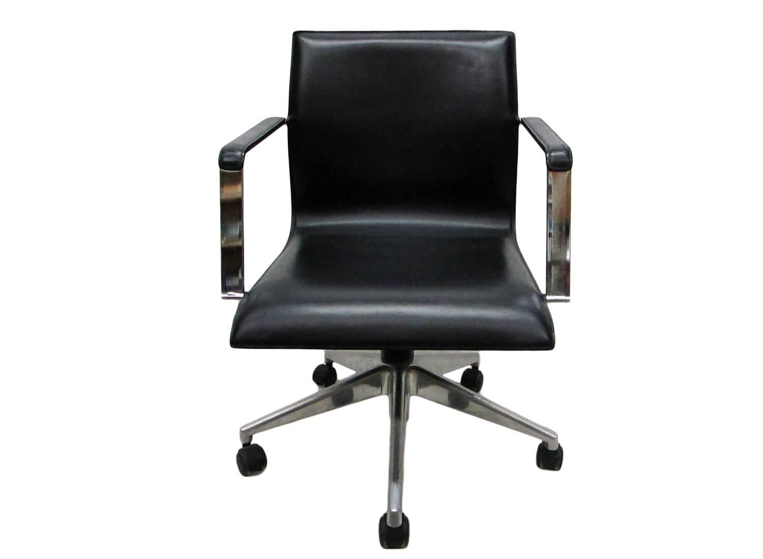 Five wheels French desk chair from the 1960s made in pressed leather and chrome.