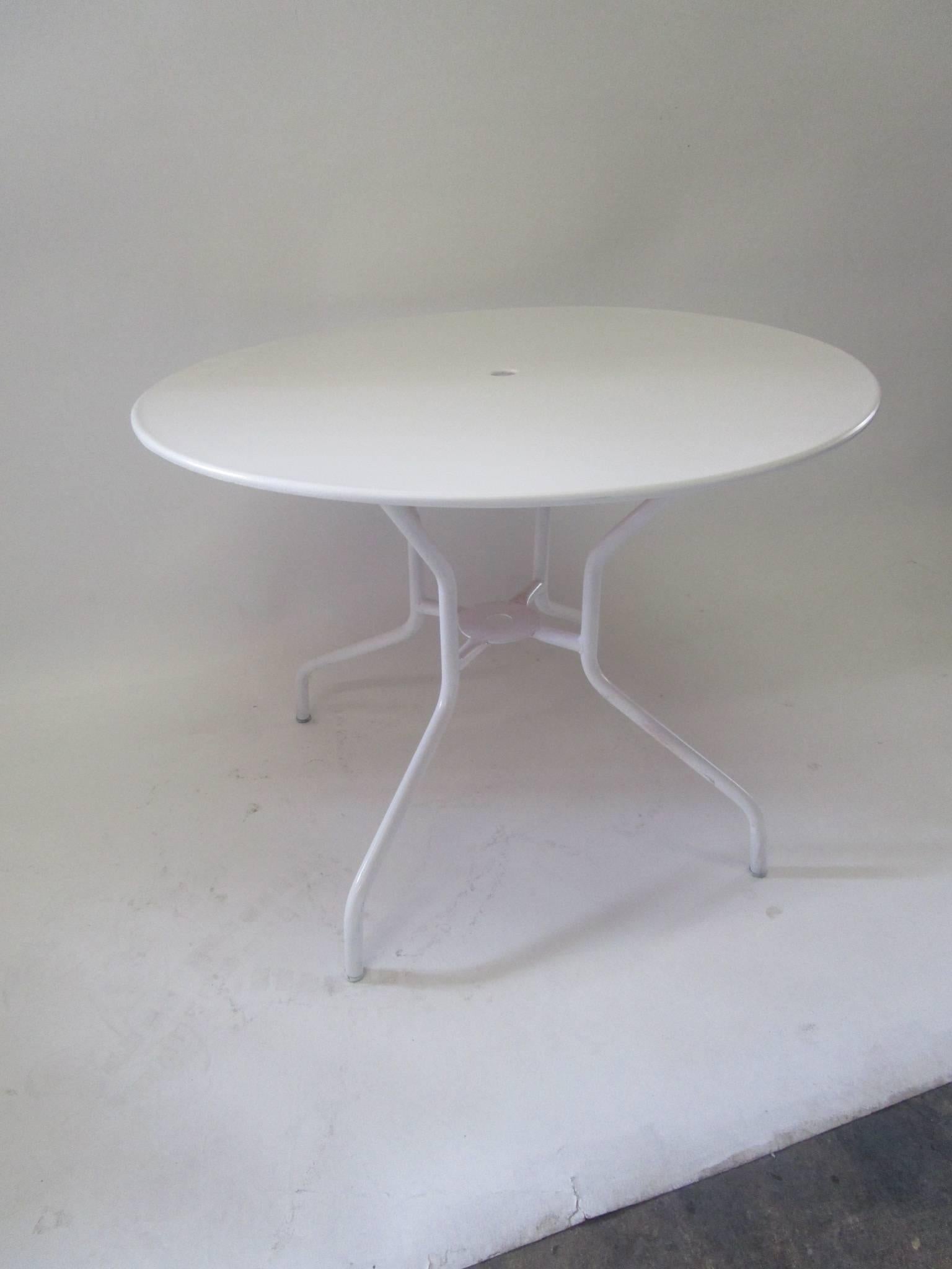 French 1950s iron base and steel top table painted in white.