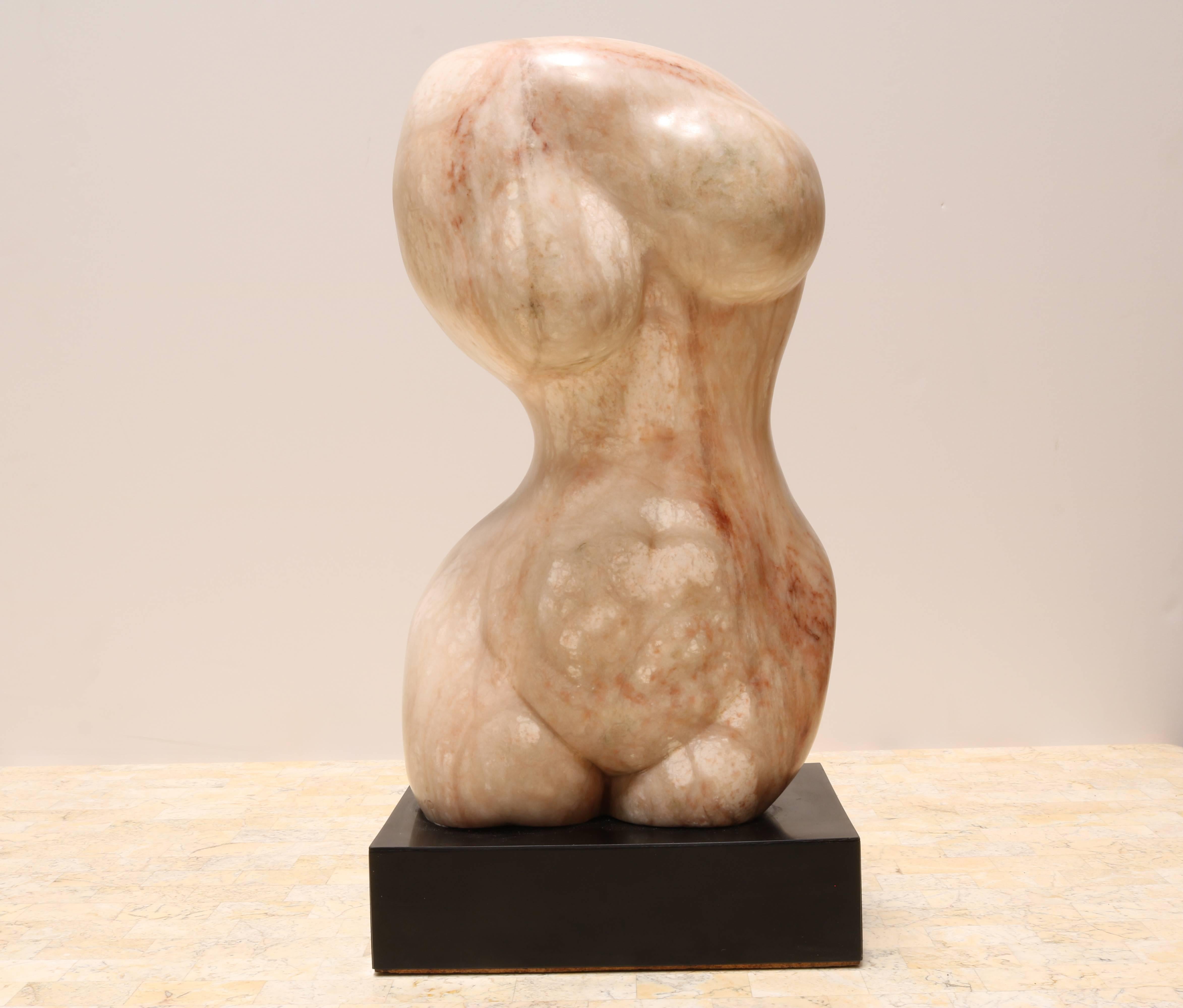 Exquisite female nude marble sculpture sits on a 2.25" H black base. Notice the artist’s masterful use of the marble's natural veins. Signed P. Haskamp.