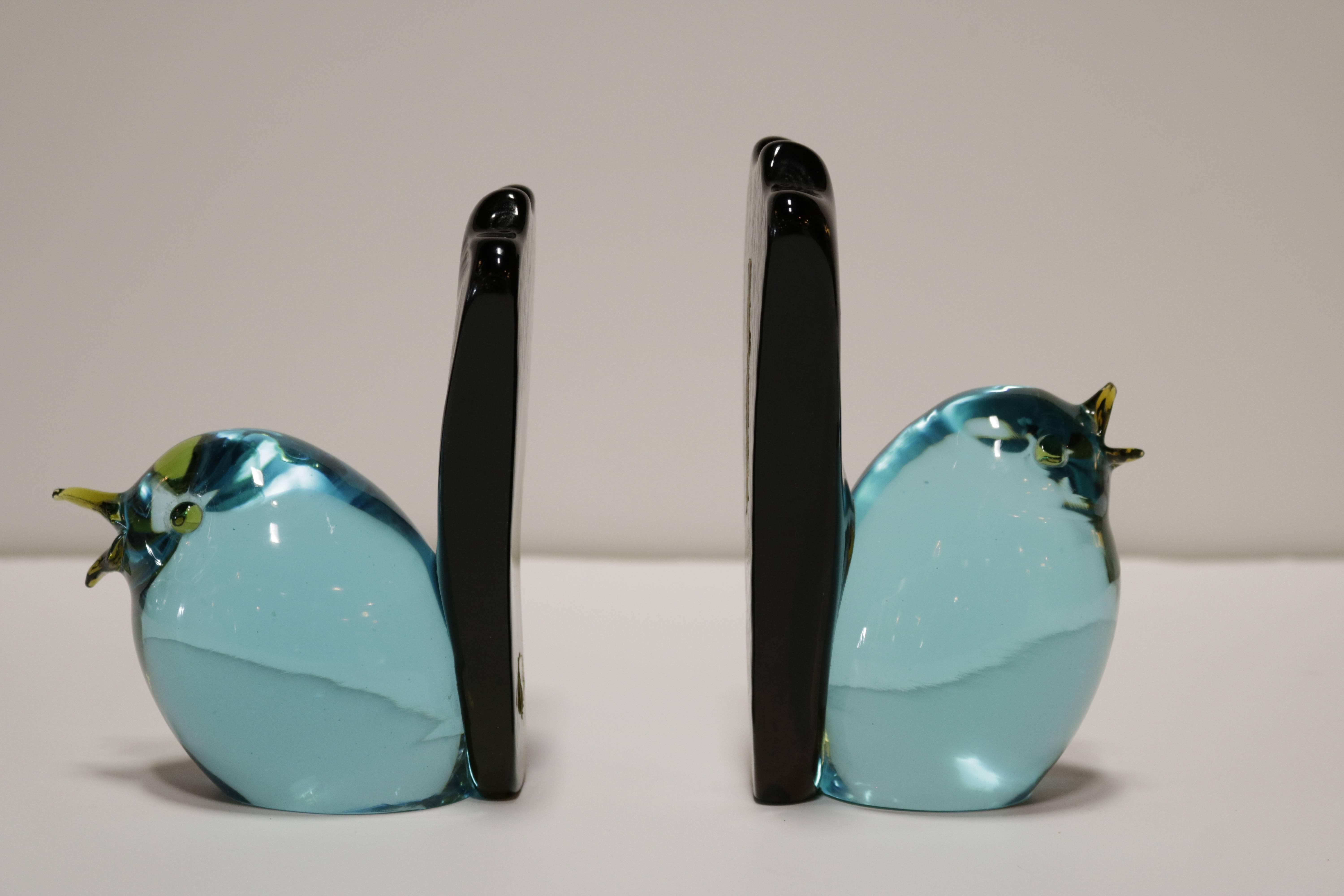 Pair of decorative Murano glass bookends by Salviati & Co. They have a turquoise blue body and olive green tail. One of the birds is 1/2 inch taller than the other and positioned slightly differently which gives a subtle touch of naturalism to