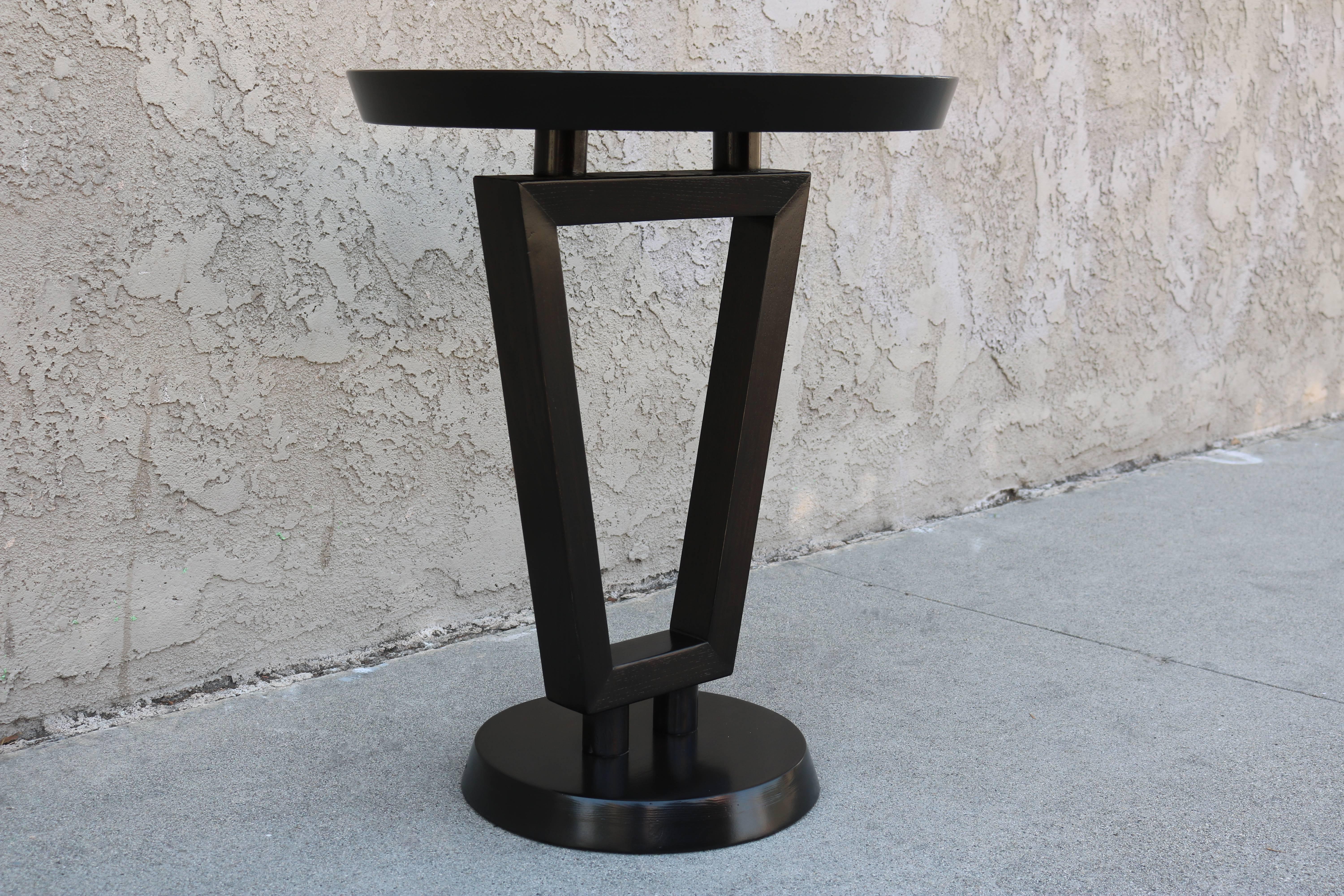Newly refinished gueridon sits on a round base and has an inverted trapezoid centre.