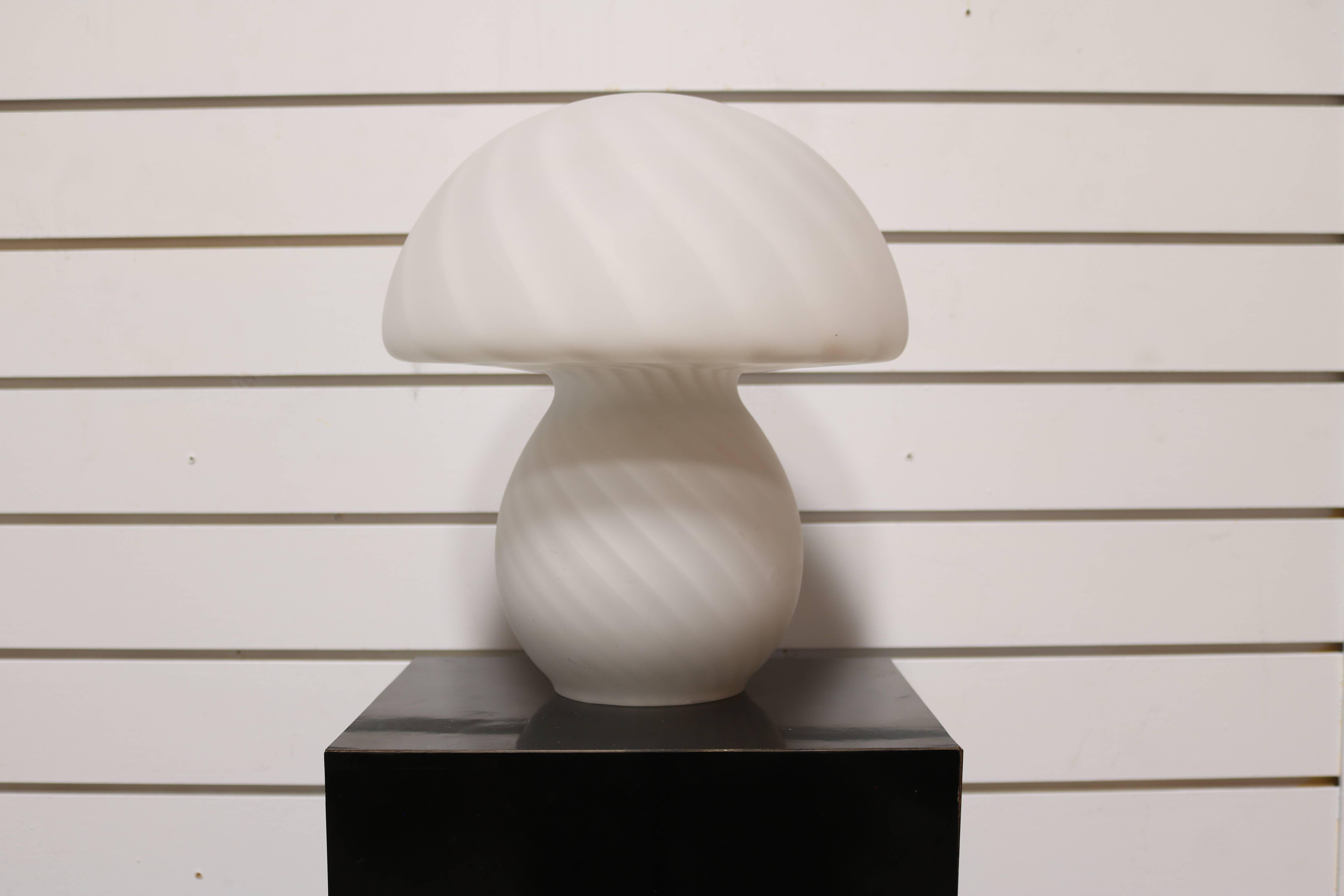 This lamp is white with a swirl pattern.