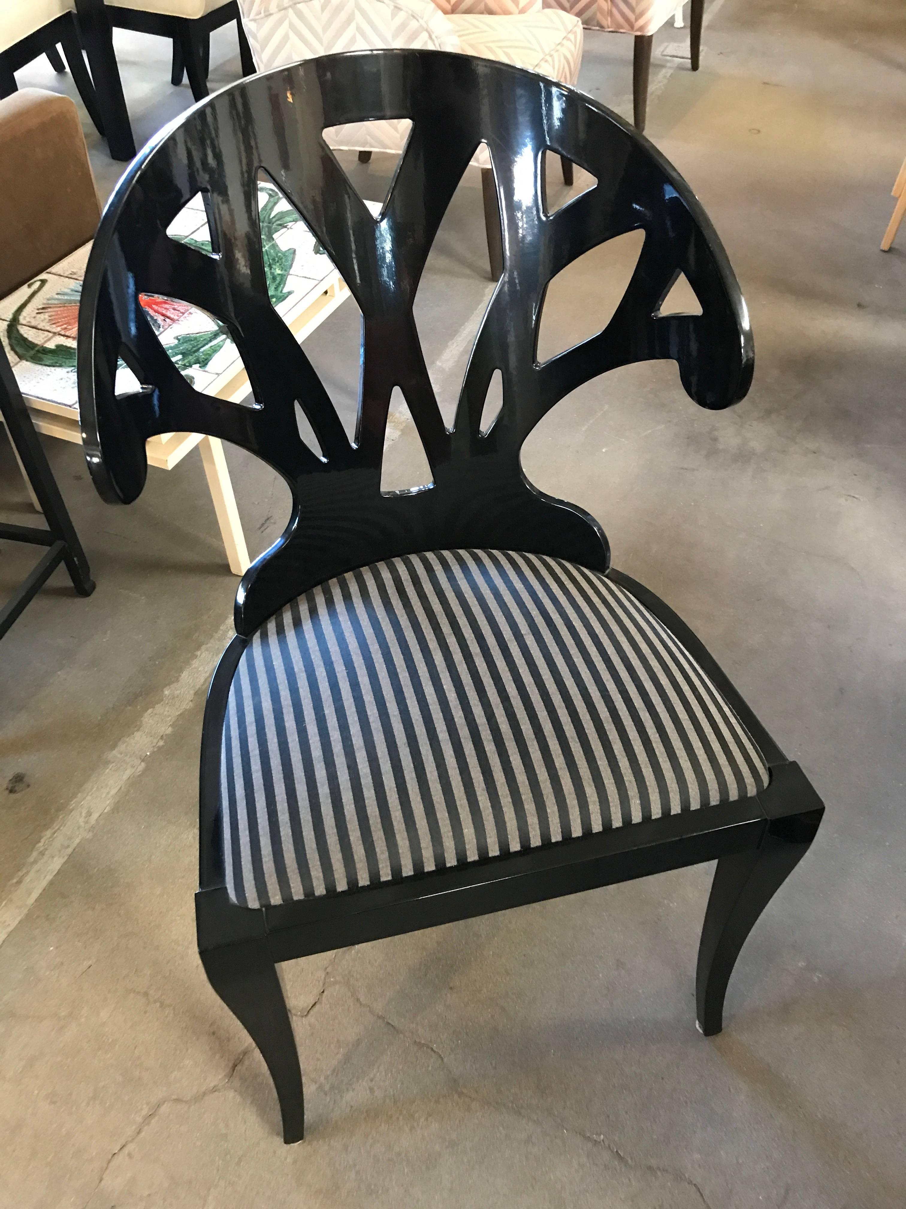 Set of eight Pietro Costantini dining chairs, labeled and numbered. Chairs are black lacquered wood with grey and black upholstered seats.
Their back shape make them very comfortable!