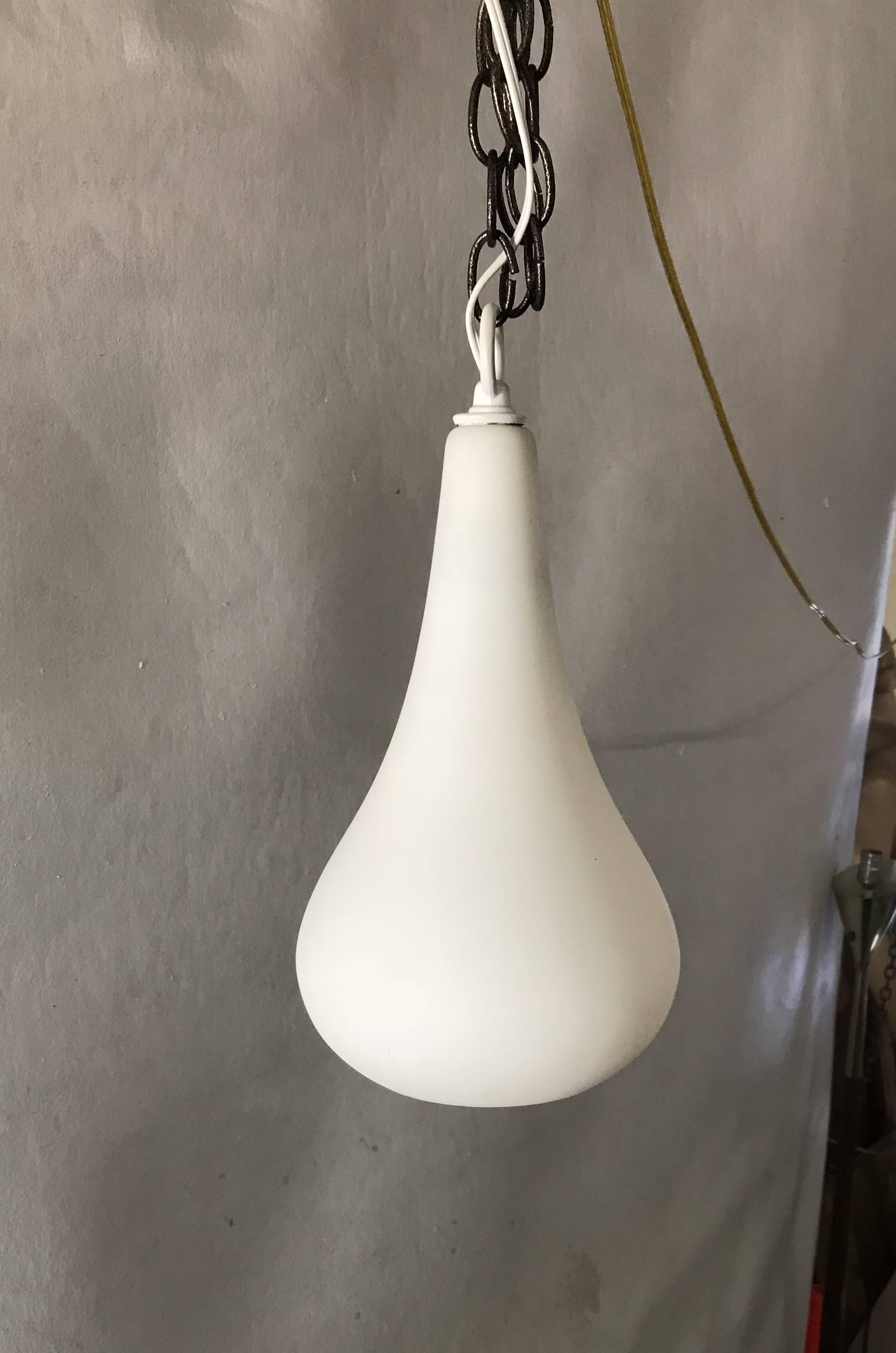 Midcentury teardrop pendant light with a frosted glass shade. Opening at the bottom so that you can change the lightbulb. Measures about 6.0