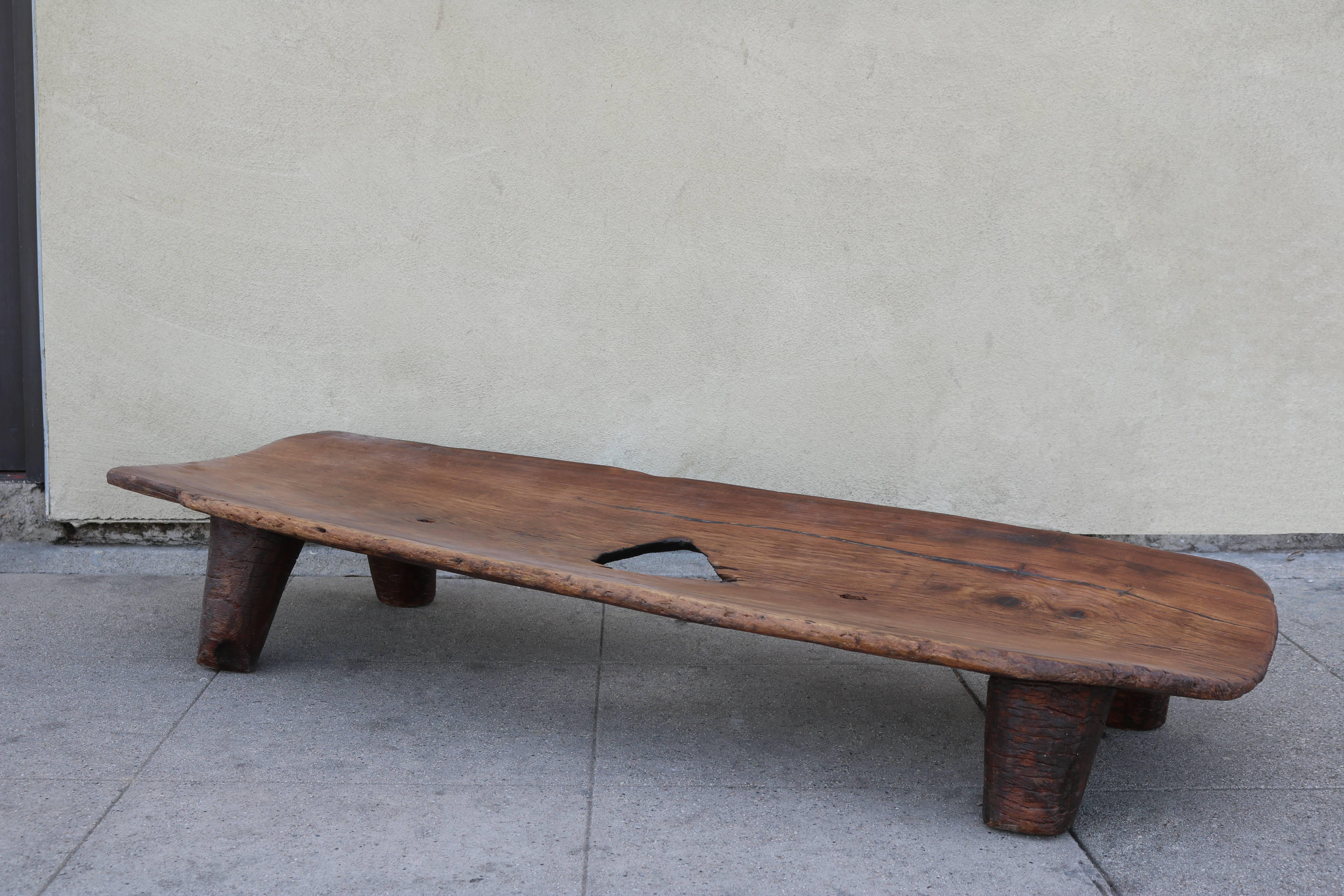 Antique carved wood bed can be used as a low bench or even coffee table. 
The Nupe people are living near the confluence of the Niger and Kaduna rivers in west-central Nigeria.