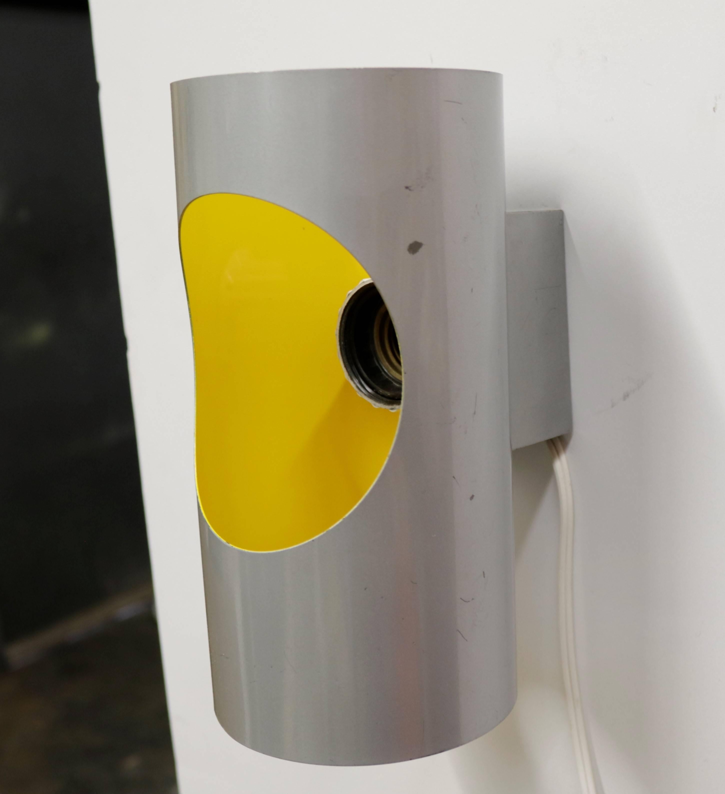Grey powder-coated steel cylinder shaped sconce with a sunny yellow interior by Gaetano Sciolari. Protrudes from the wall 5.25
