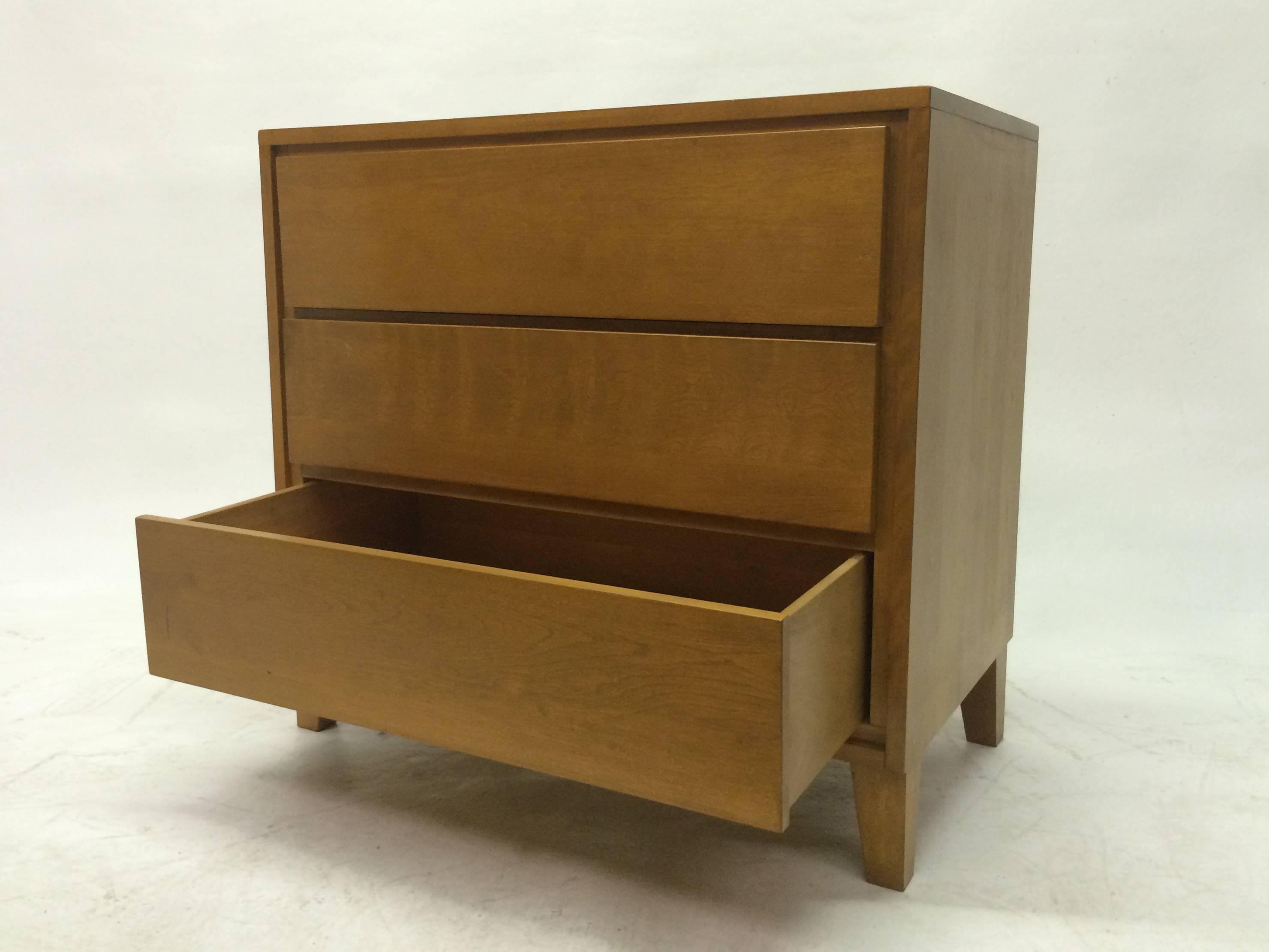 This 1950s designed dresser by Russel Wright for conant ball features three drawers made of solid maple. Russell Wright was an American industrial designer working during the early 20th century. He helped bring modern design to the North America