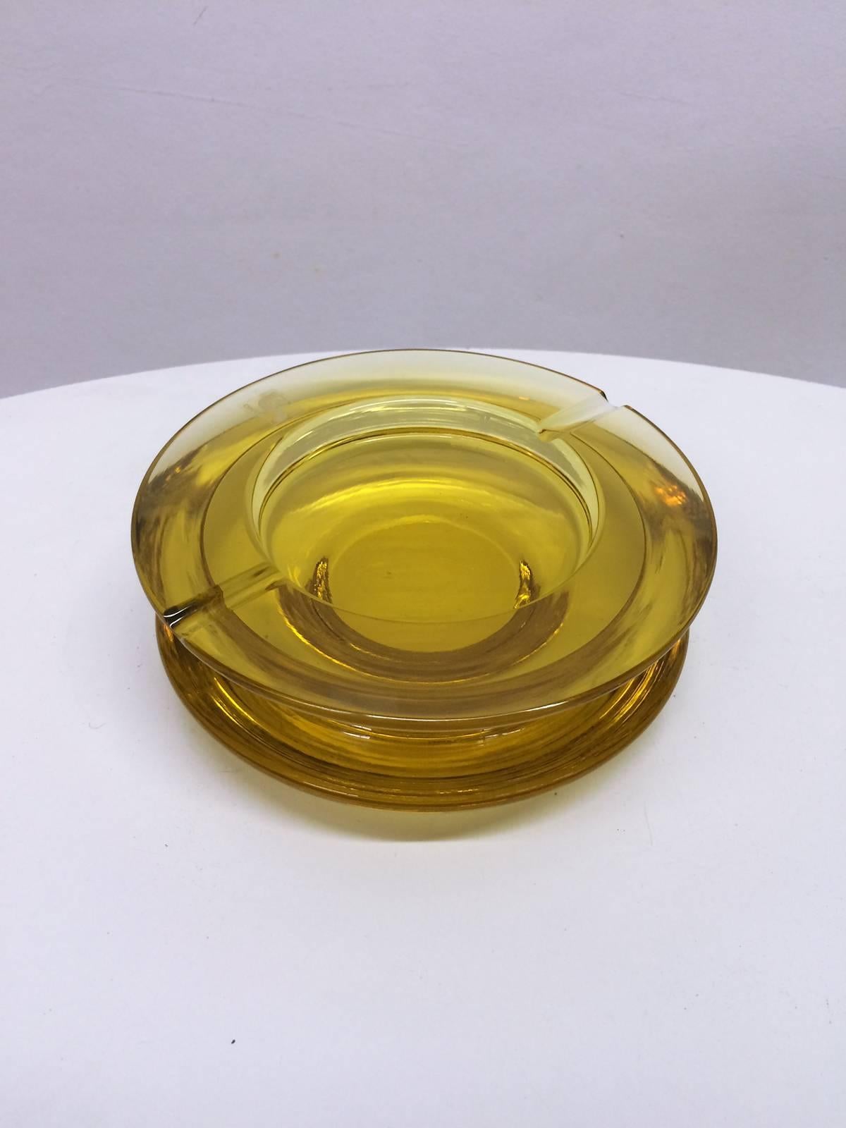 This is an original tinted glass ashtray designed and produced by the Italian glass and lighting company Murano. Very chic and modern feeling.
It wears the labels Murano Seguso.