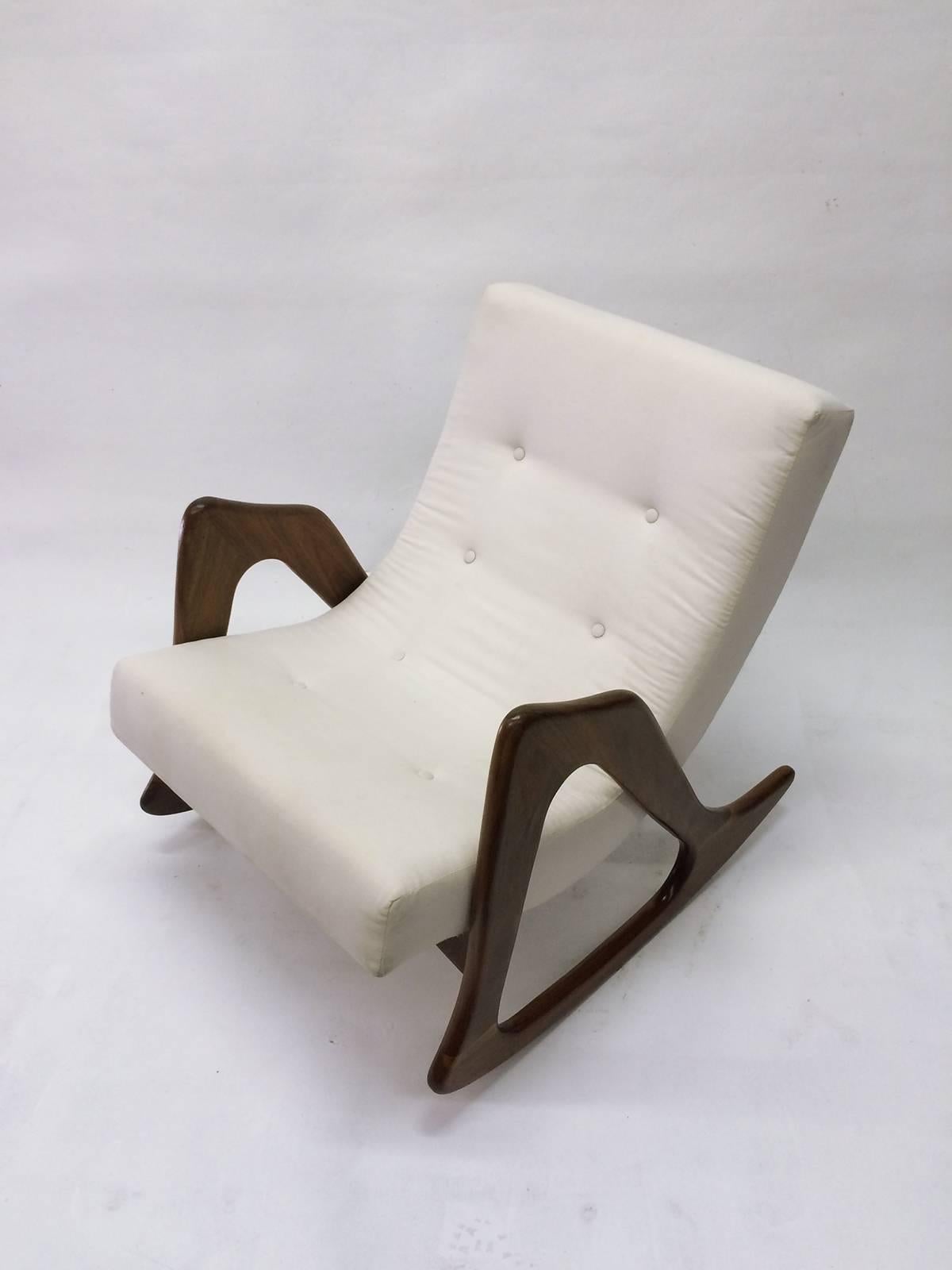 A beautiful, sculptural walnut rocking chair designed by Adrian Pearsall for Craft Associates.  Chair has original upholstery and is very comfortable. 