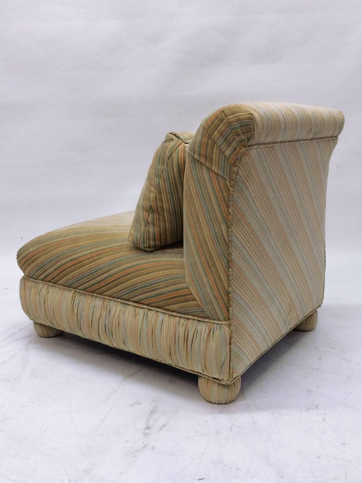 Pair of  slipper chairs by Milo Baughman.  Chairs are both in original striped multicolored velvet dominated by yellows, greens with blue and orange accents.  