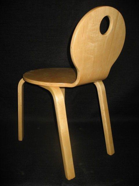 A set of two bentwood children chairs stamped Thonet, in honey tone finish detailed by a simple cutaway dot in the circular back.
