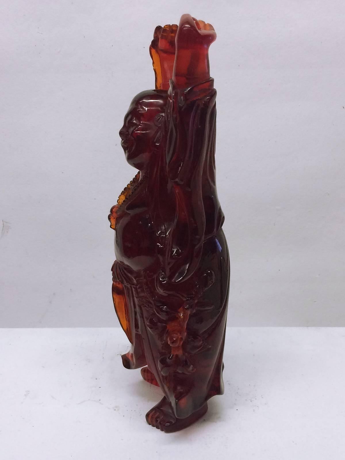 red resin buddha figurine
