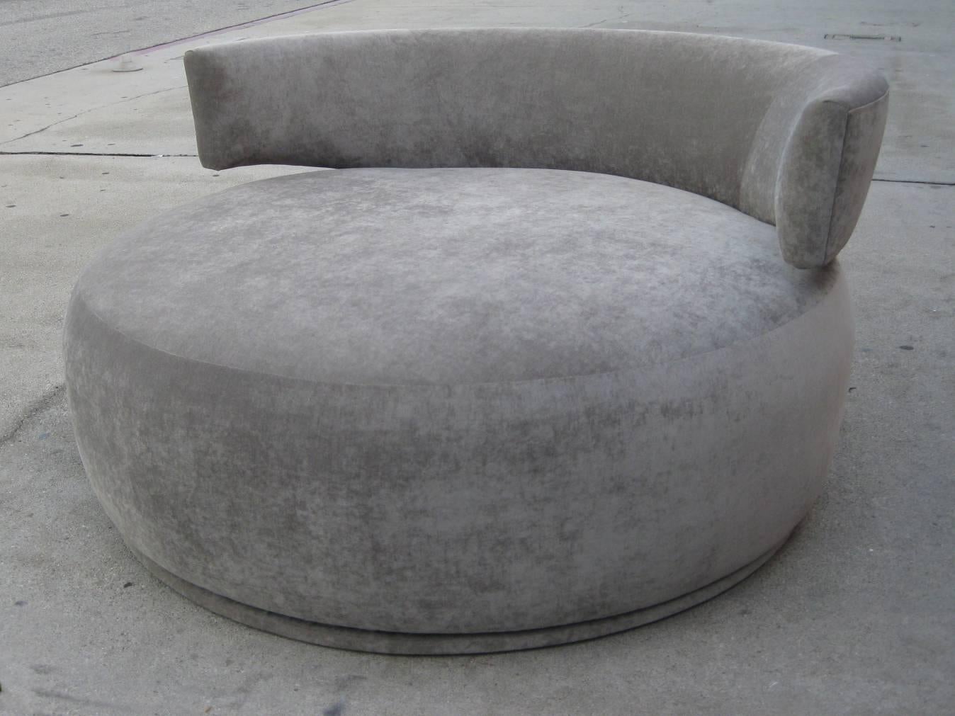 Mid-Century circular love chair with round back. Newly reupholstered in a light grey chenille.