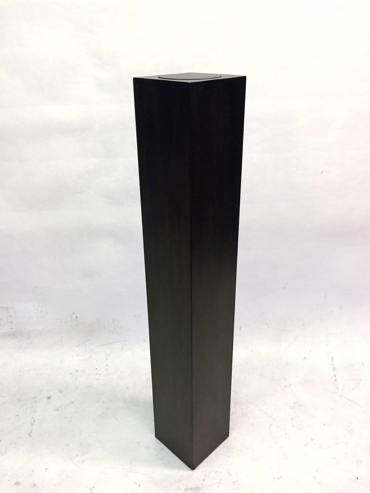 Rare pedestal finished in dark ebony stain with an inset swivel top. Would allow your sculpture to rotate and show every side.
