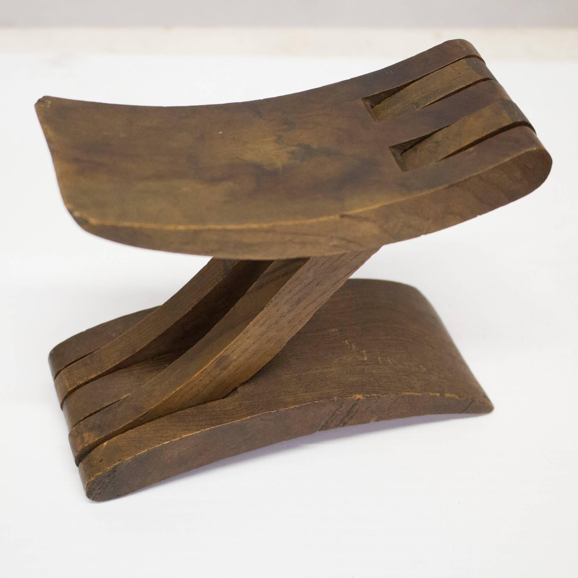 An authentic African headrest. These traditional hand-carved pieces were personal accessories. Types of woods used and designs vary by region and culture. This is an excellent specimen.