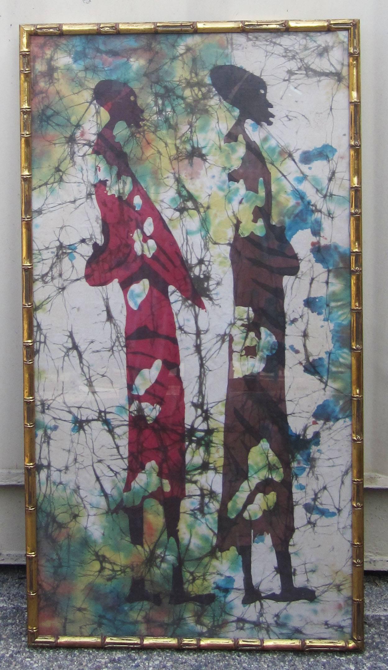 African batik on cloth. In a gold faux bamboo frame.