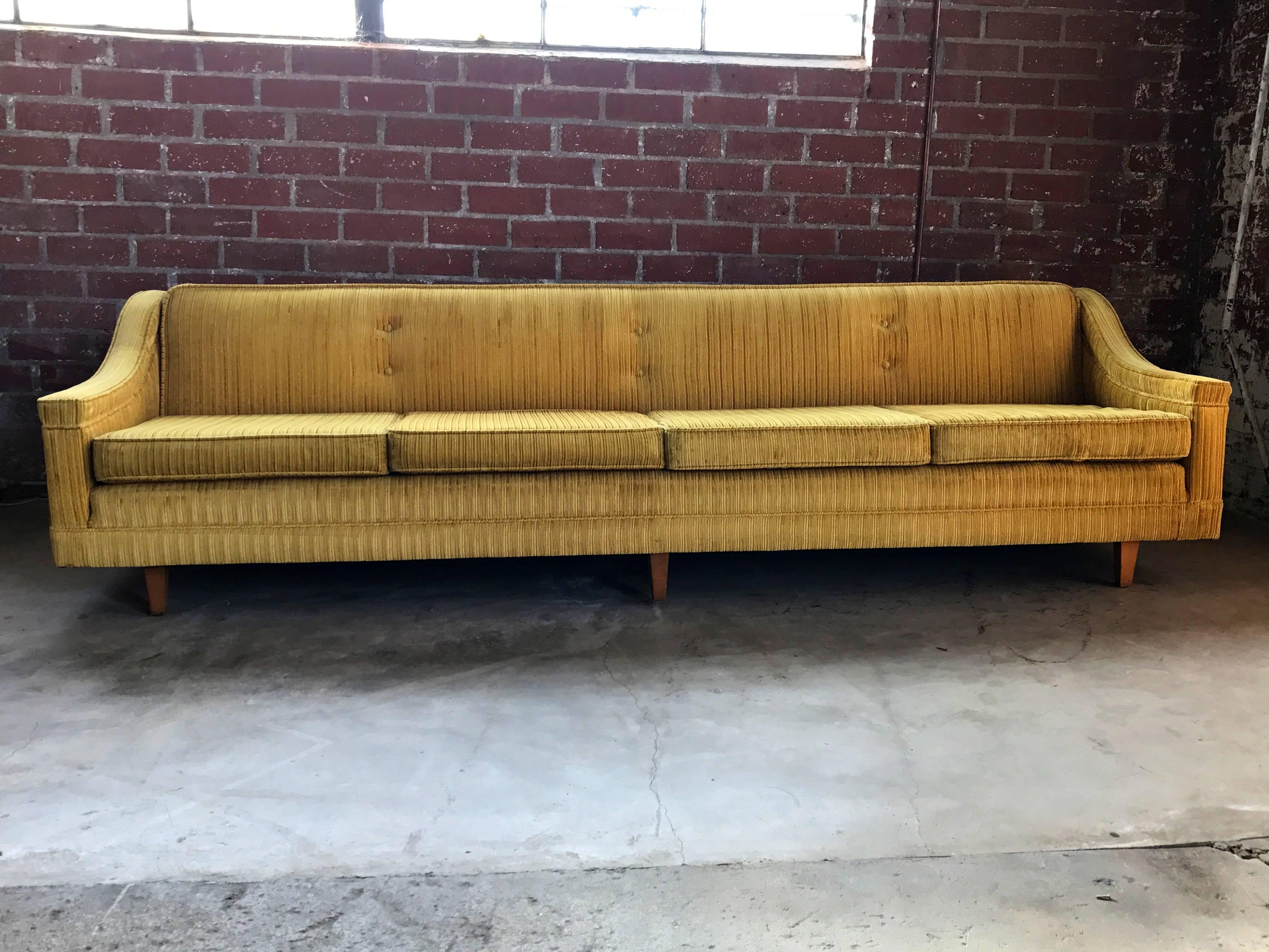 1960s Harvey Probber sofa upholstered in gold velvet corduroy fabric. Wooden legs.