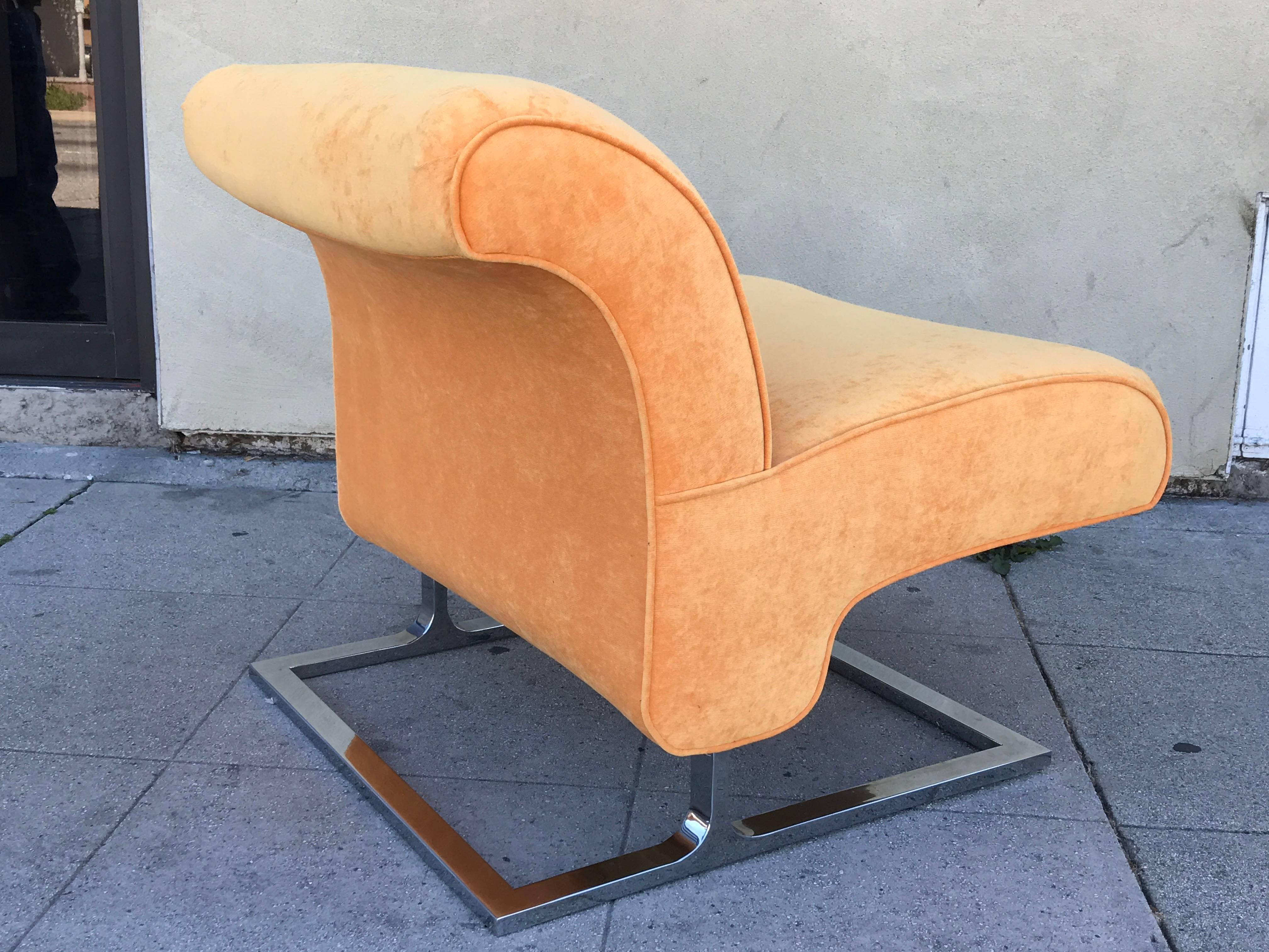 Unusual pair of slipper chairs attributed to Milo Baughman feature a chrome base and are upholstered in a soft mandarine chenille.