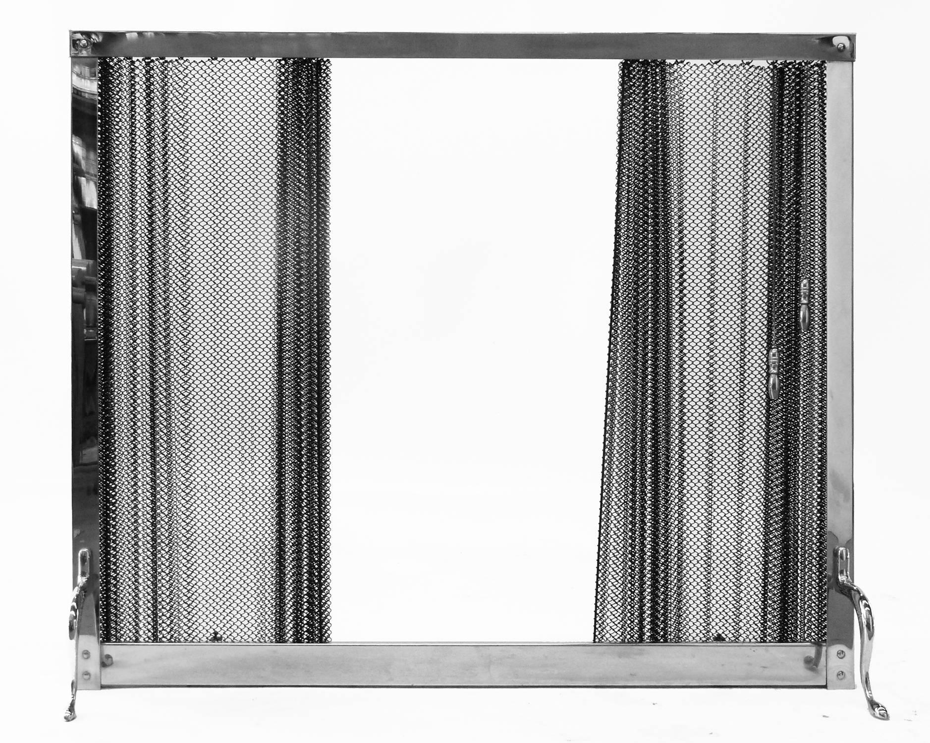 1970s chromed fireplace screen with a sliding metal curtain.