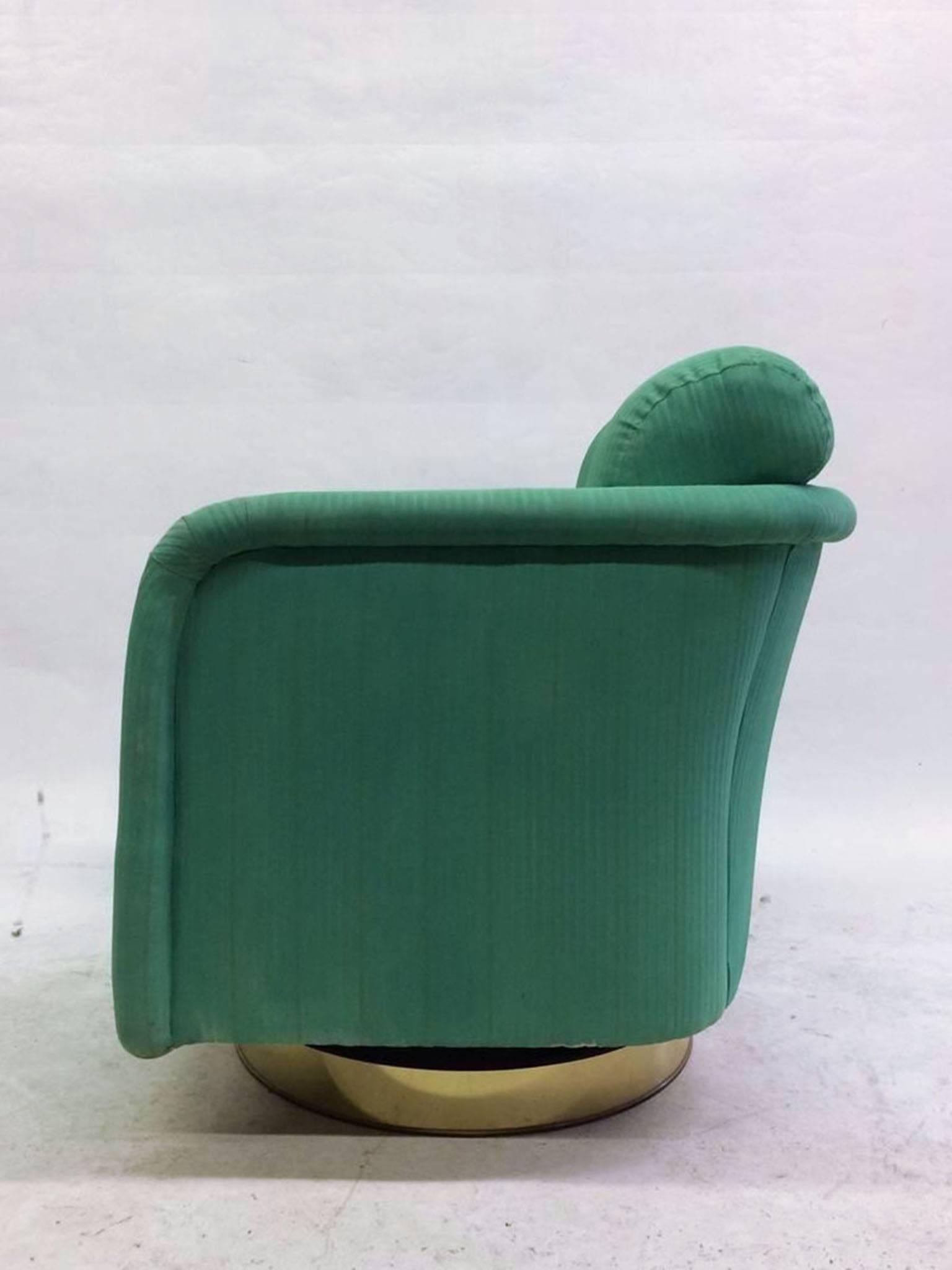 Swivel chair with a brass base designed by Milo Baughman.