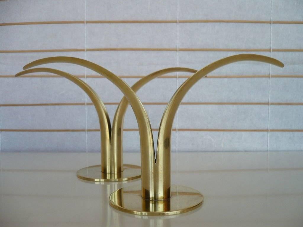 A pair of split blade leaf form solid brass candle holders made for Ystad-Metall, Sweden, stamped with foundry makers mark and designers individual stamp above the Y-logo.