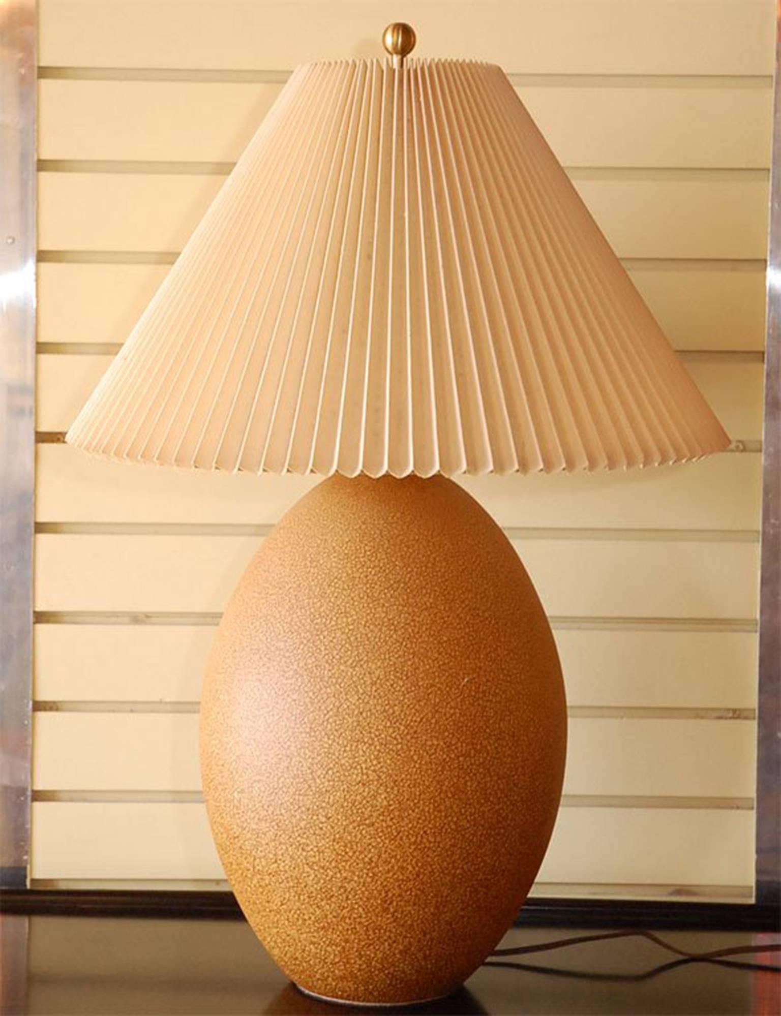 Pair of egg ceramic lamps with their original shades.

Beautiful color and light!