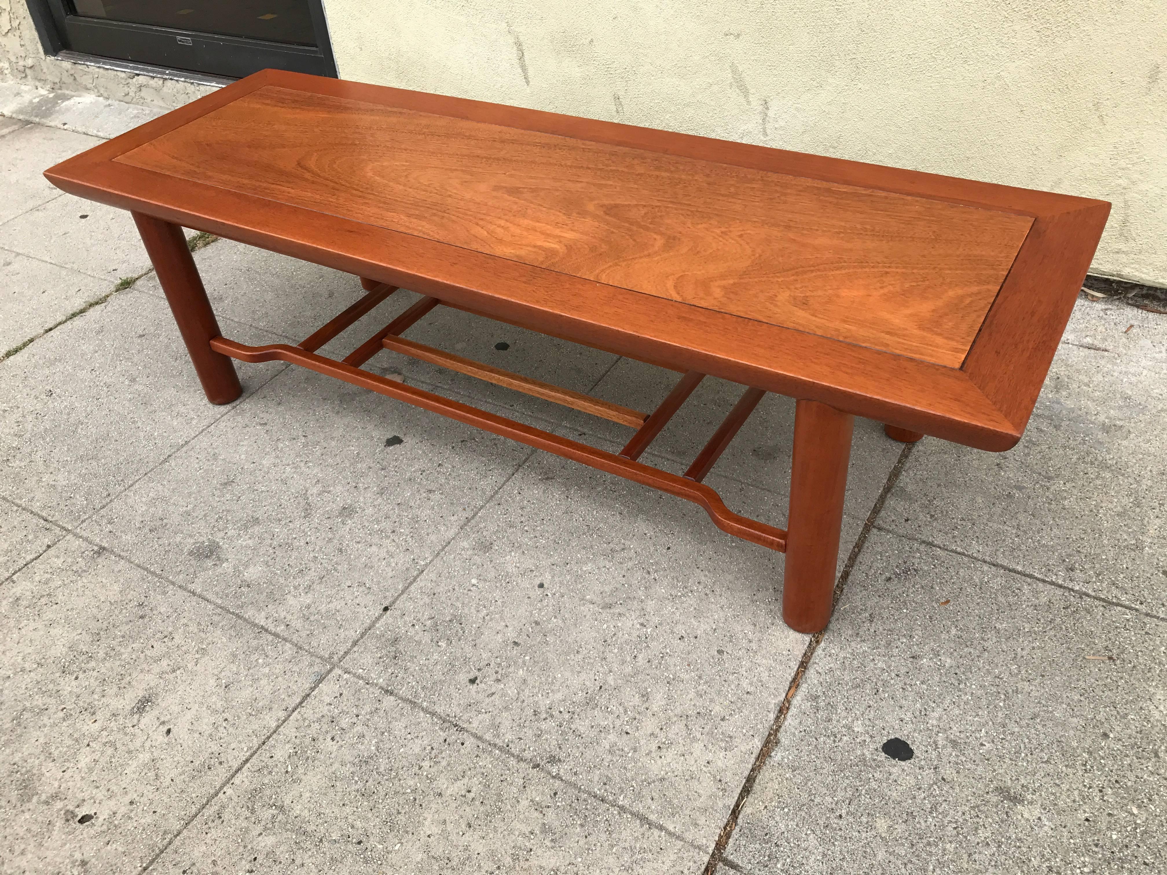 Newly refinished Heritage Henredon two-tier coffee table.
The shelf underneath is very useful to hold books and magazines.