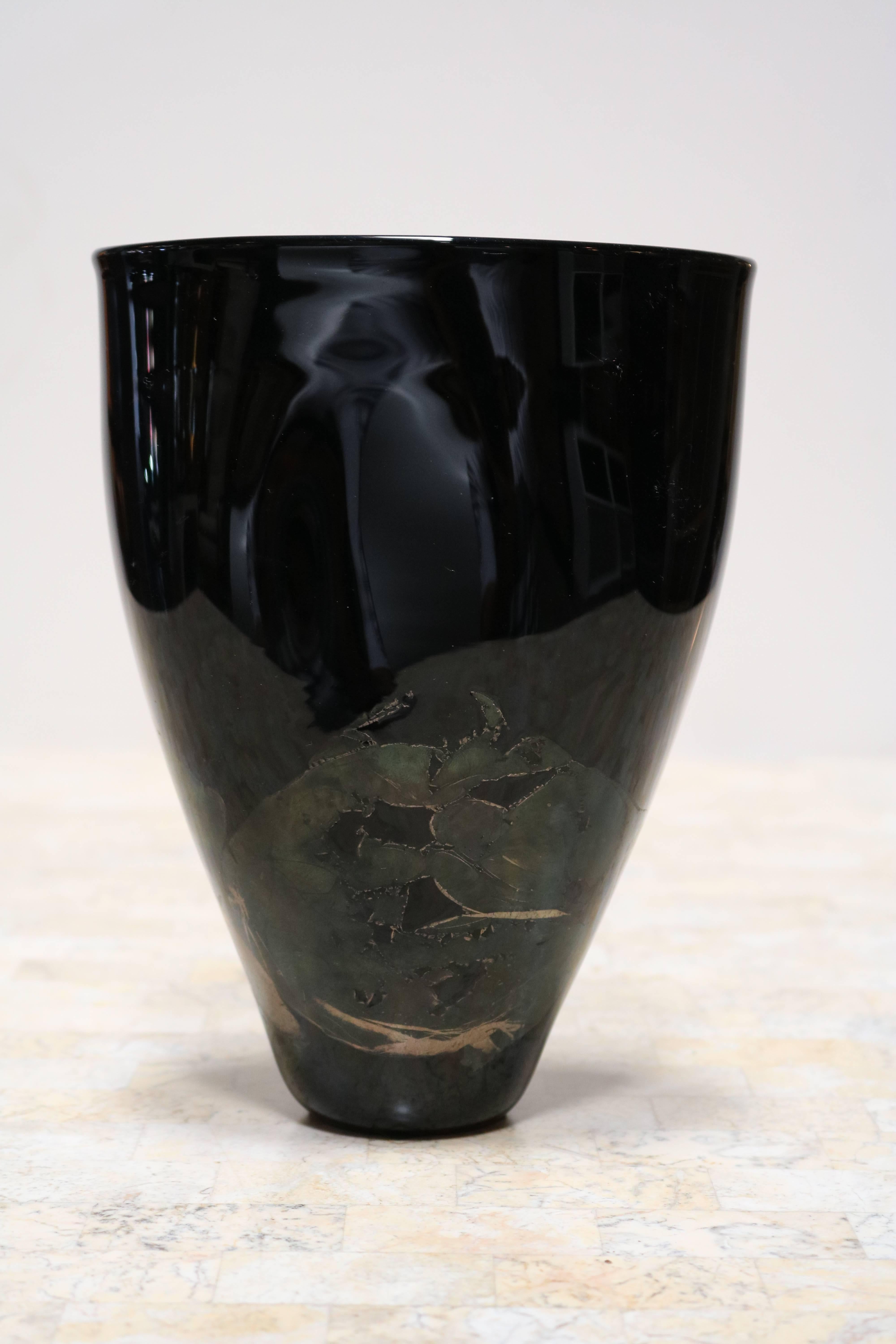Organic black glass vase with iridescent overlay.