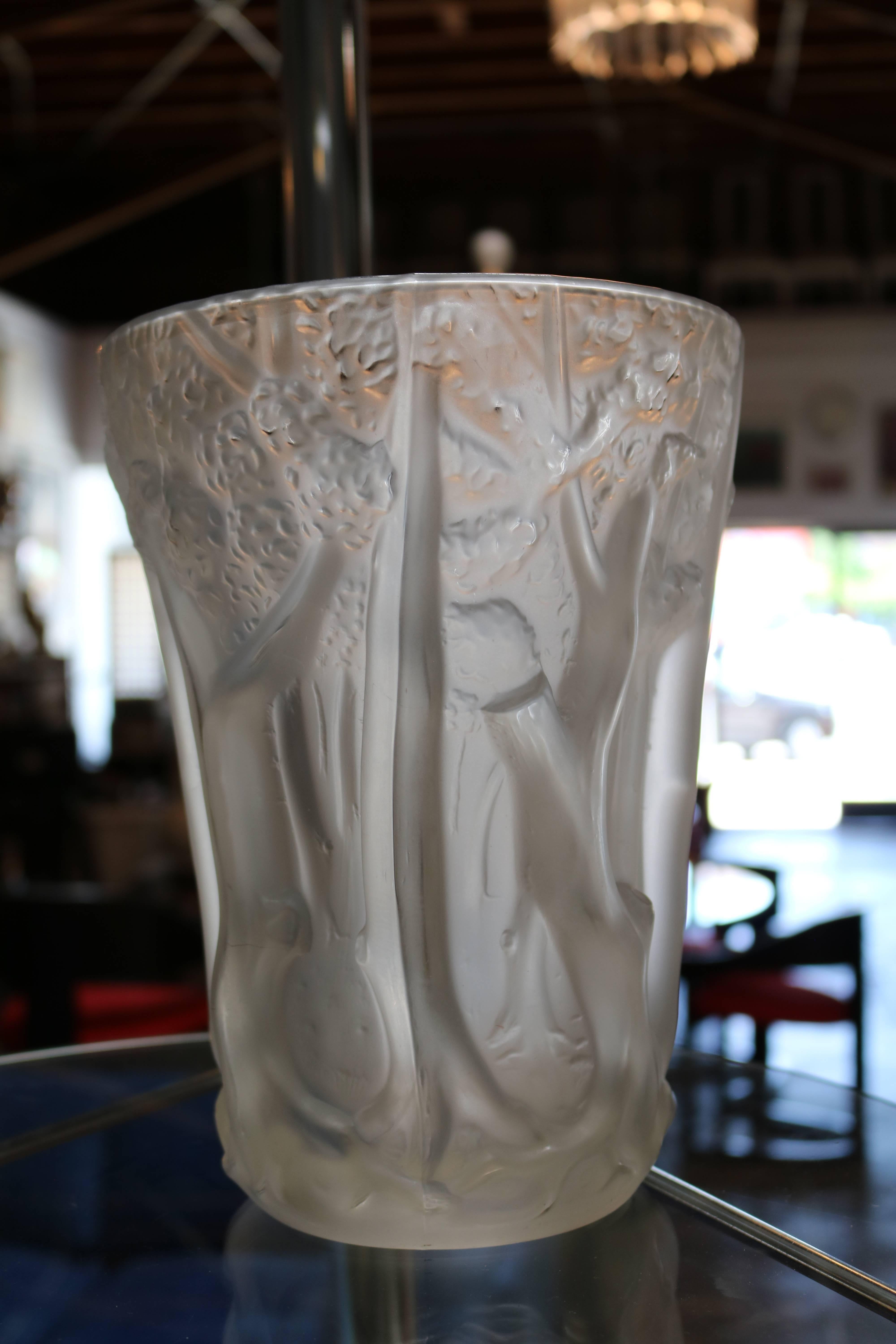 Thick and heavy frosted molded glass vase has multi-dimensional trees shown in relief. Bottom of vase measures 4.75" in diameter.