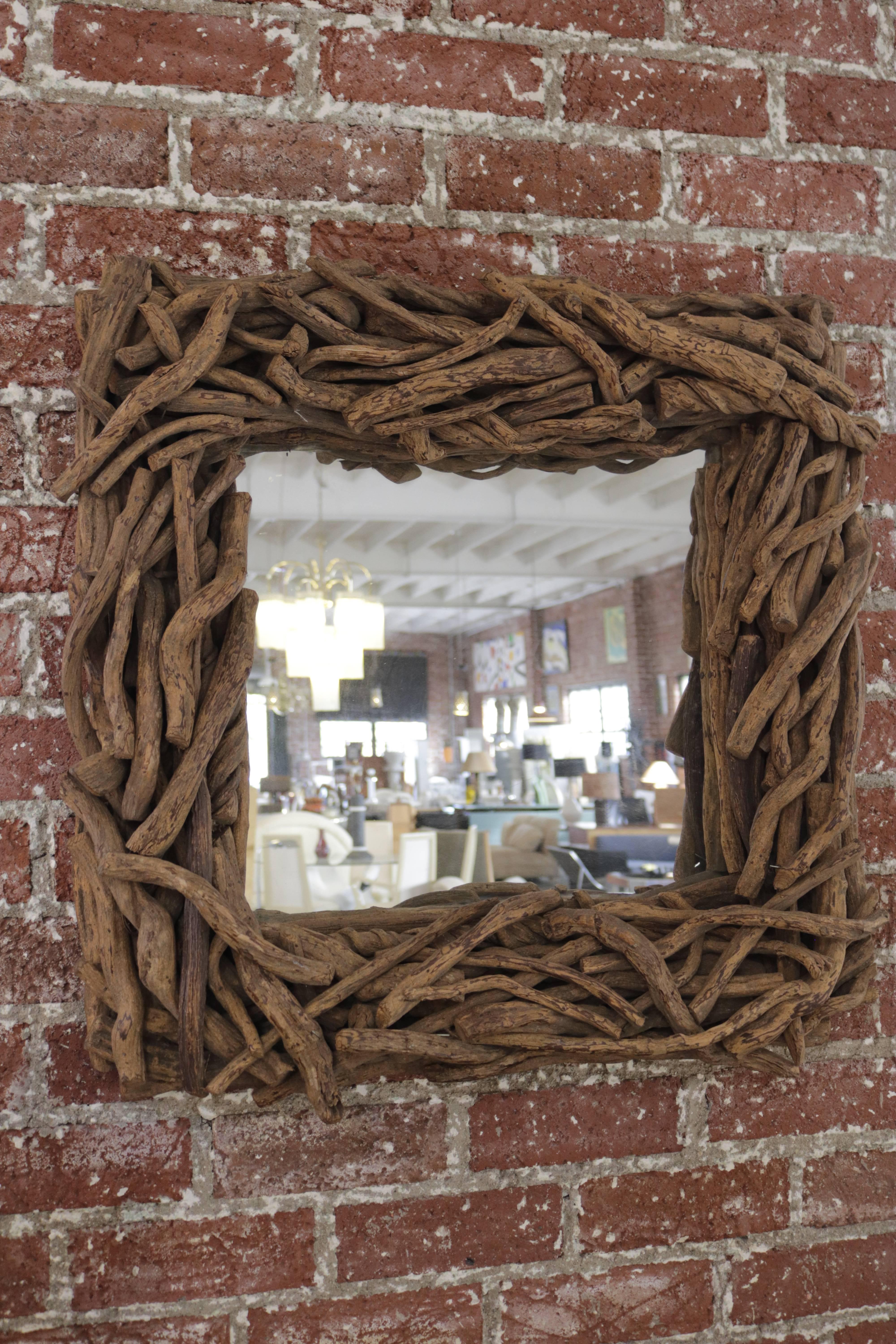 Square shaped mirror made of bundled driftwood. Perfect an organic atmosphere!