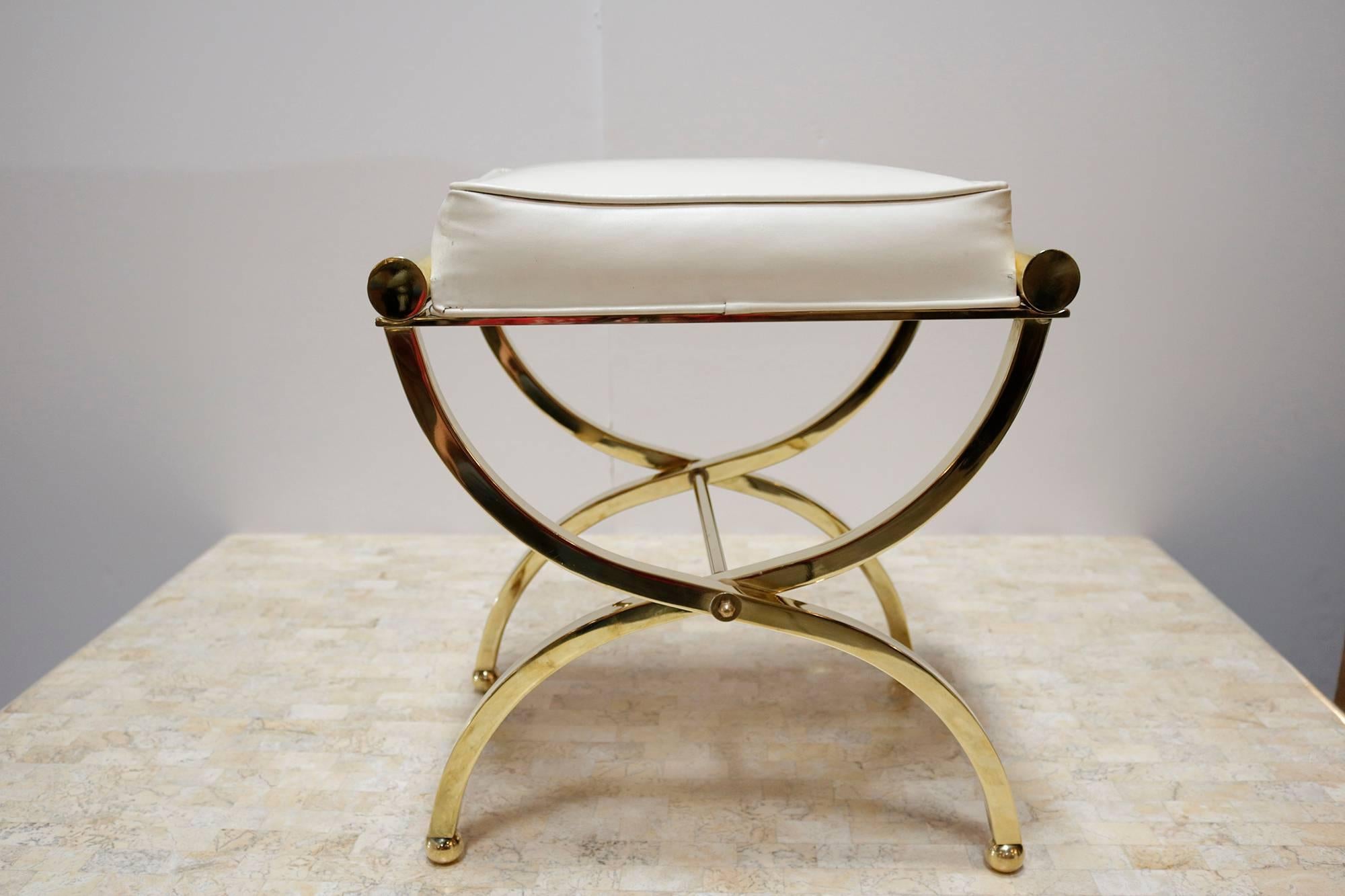 Charles Hollis Jones is an American artist and furniture designer who is recognized by the Smithsonian Institution for his pioneering use of acrylic and Lucite. This brass "Arnez" bench is from the Ball line - named after Lucille Ball