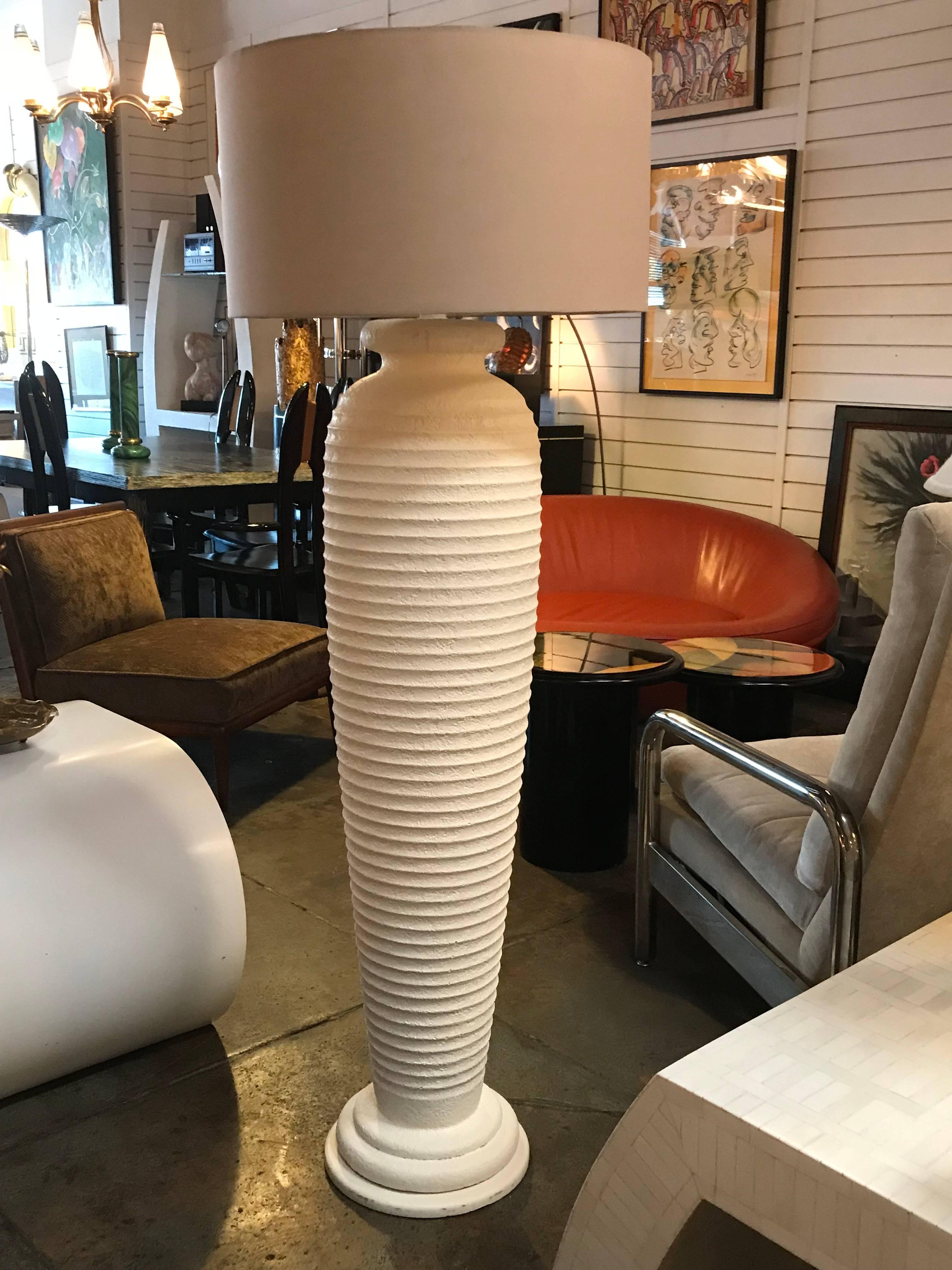 Cream textured plaster 1980s floor lamp

Measures: 63.0" to top of finial or 51.0" to bottom of harp.
Fabric shade is 22.0" in diameter.