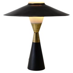 Table lamp in metal and turned brass with opaline glass