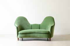 Cesare Lacca rare two-seater sofa with enveloping lines