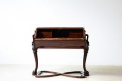 1800 roll-top desk featuring a cylindrical body enclosed by a tambour shutter