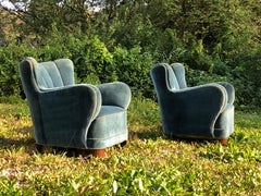 Pair of low back sculptural 1940s Danish cabinetmaker armchairs