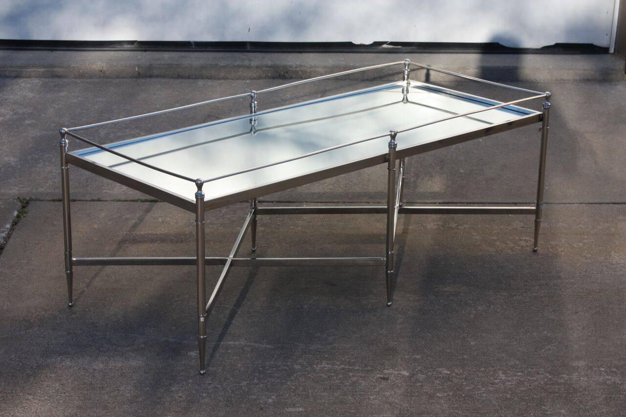 Mid-Century, short and wide, glass and chrome console, or coffee table. Six ball finials and six ball feet. Legs are pointed towards the feet. Chrome cage connects the finials and provides additional rigidity not provided by the criss-crossed X-form