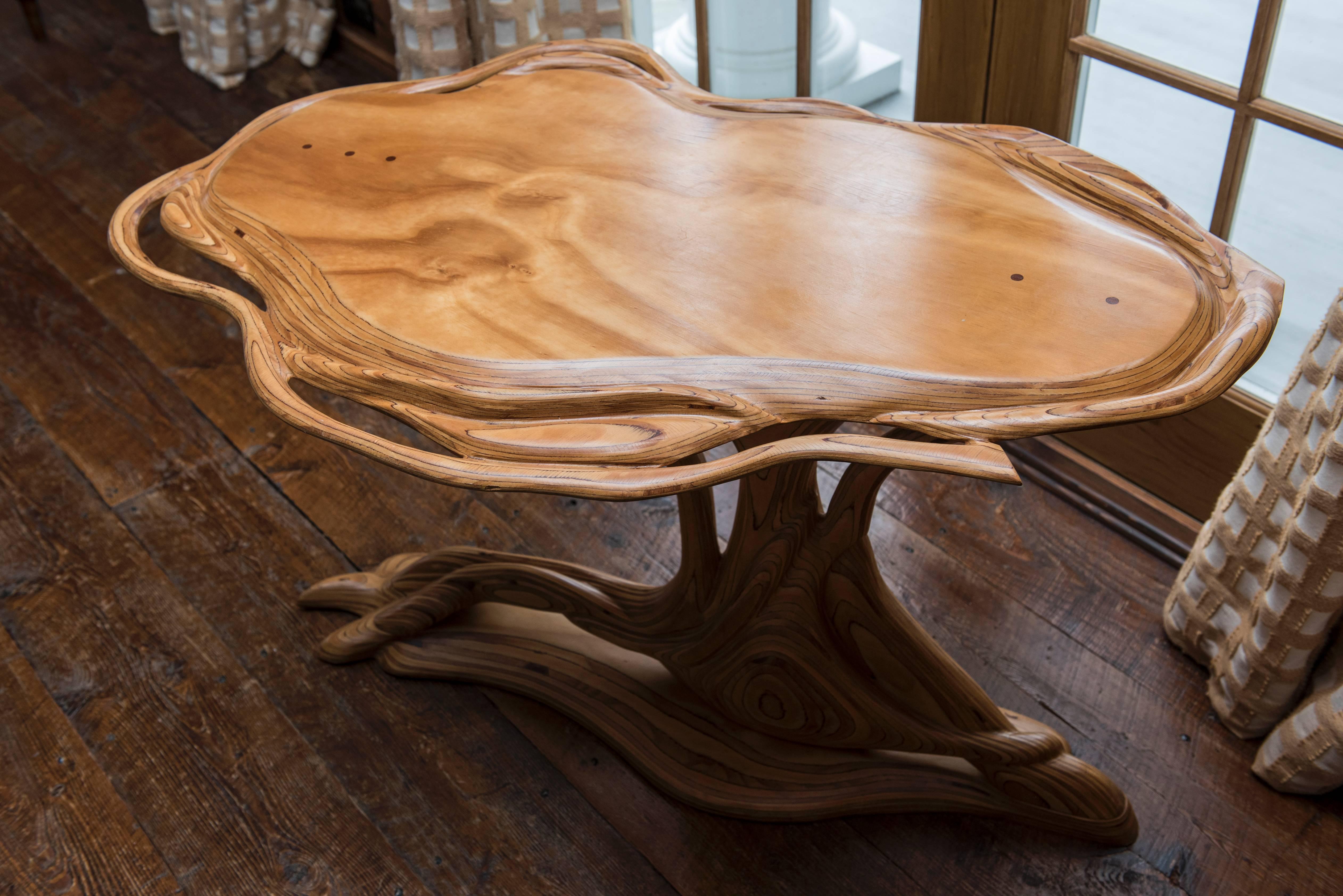 Root table, sculptural, artistic style.
