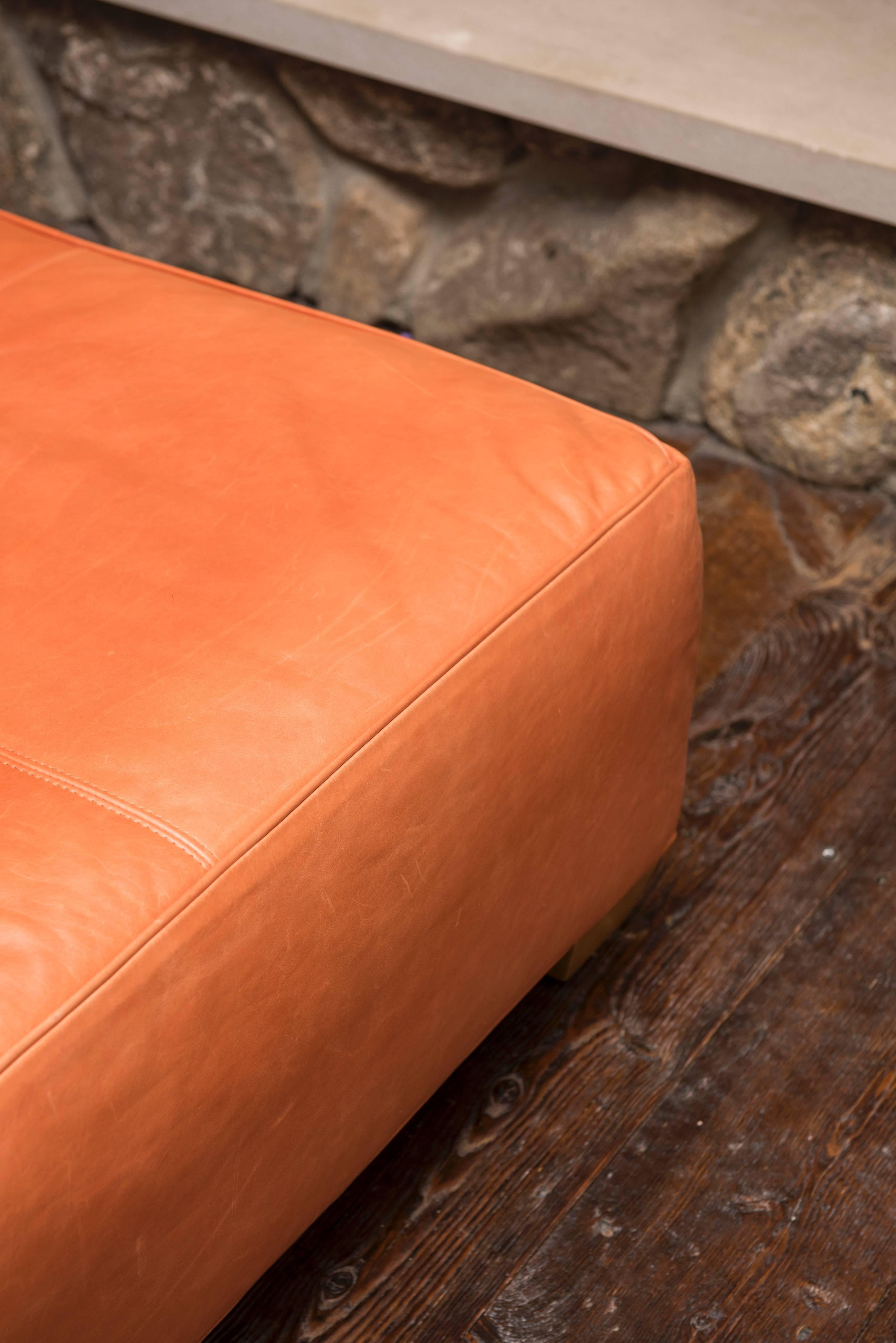 Soft leather ottoman.