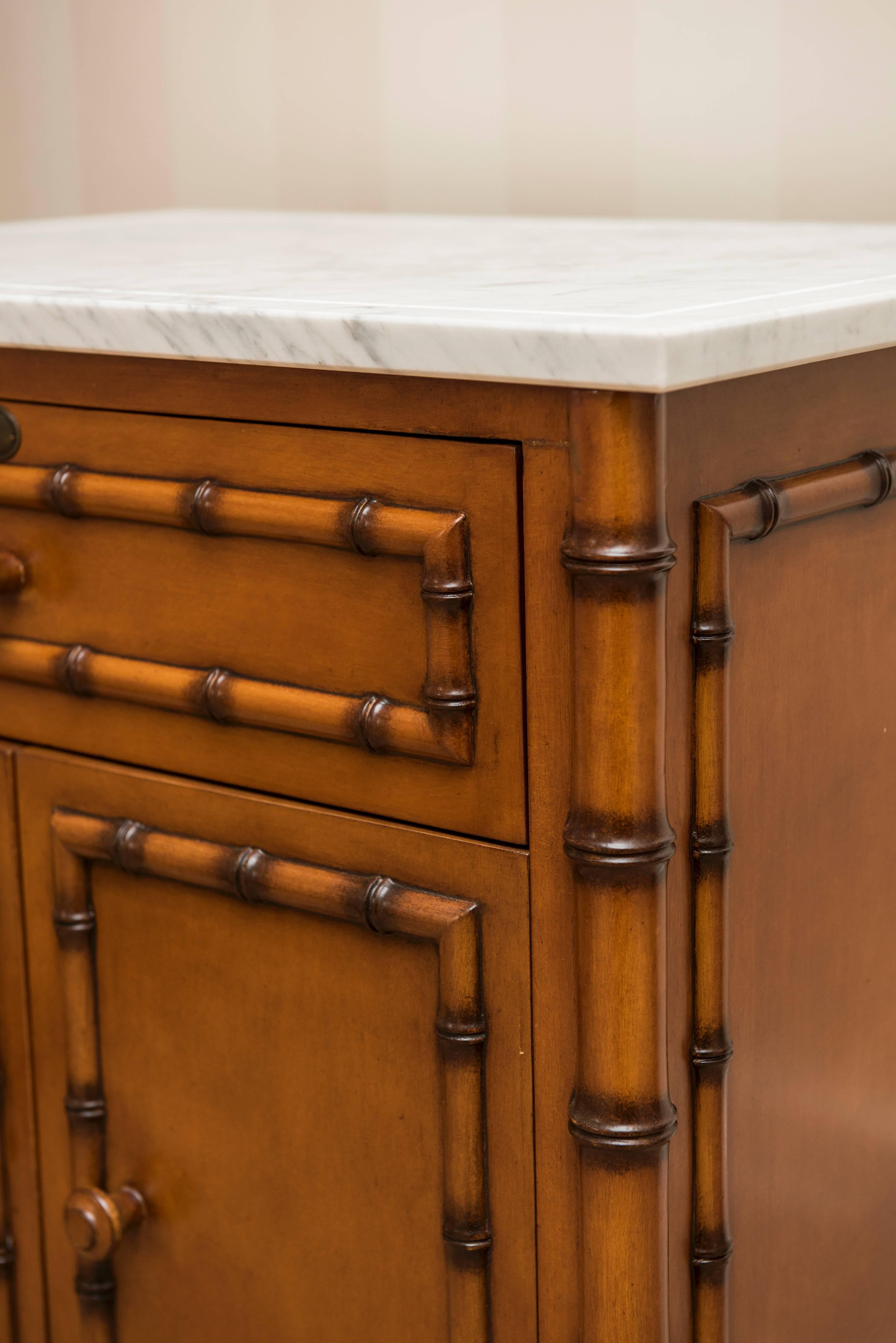 Marble-top, cabinet with lockable drawer.