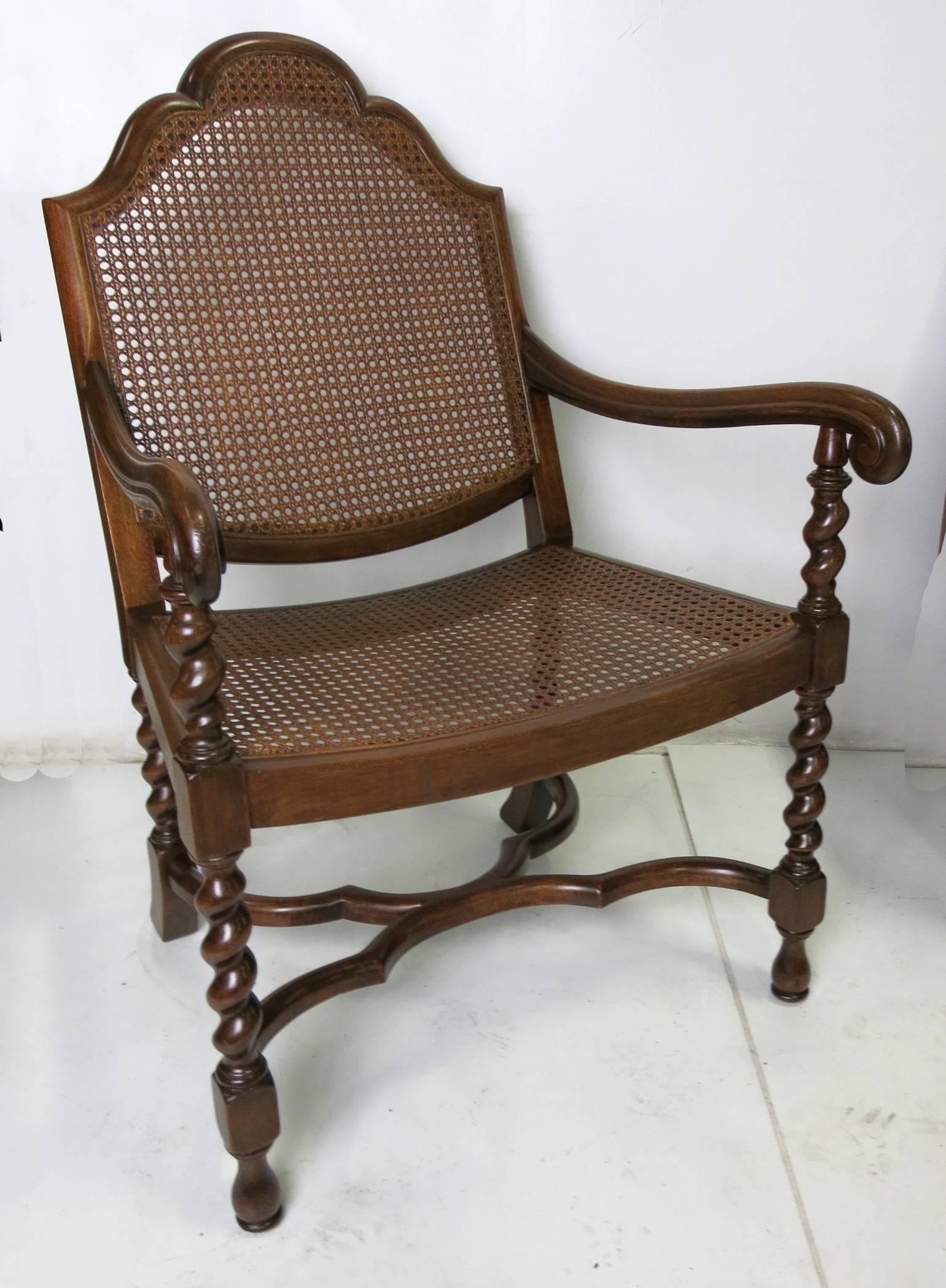 Meticulously restored hand-carved mahogany armchair with caned seat and back. Fabulous quality workmanship and materials. The chair feature ample dimensions and will work well as either a man's or woman's desk chair.