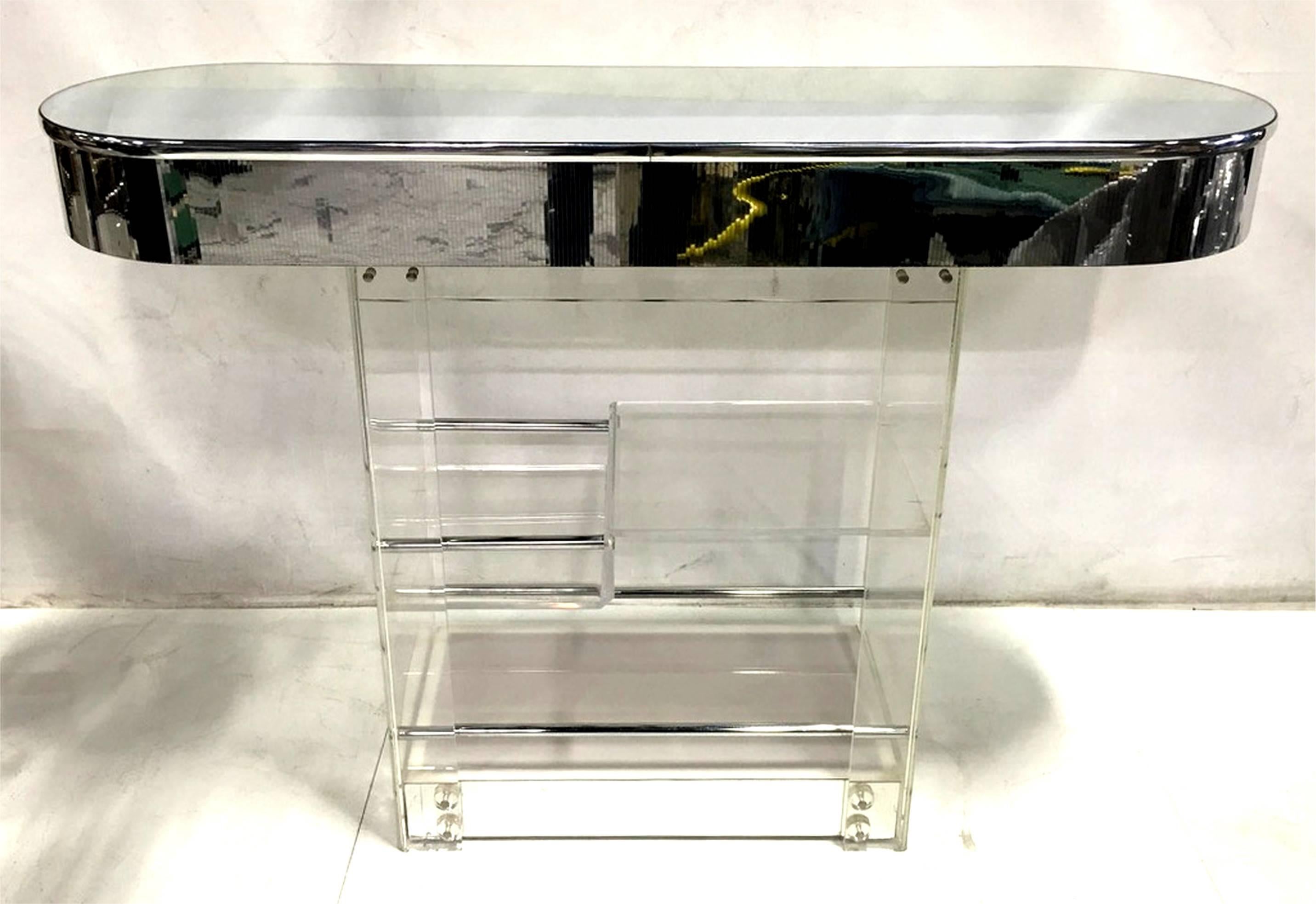 Beautiful vintage Lucite bar with mirror trim and chrome mounts by Hill Mfg. Hill made the best of the best Lucite furniture and fixtures, heads above any other shop, and their designs have become iconic and collectible. The bar is in excellent