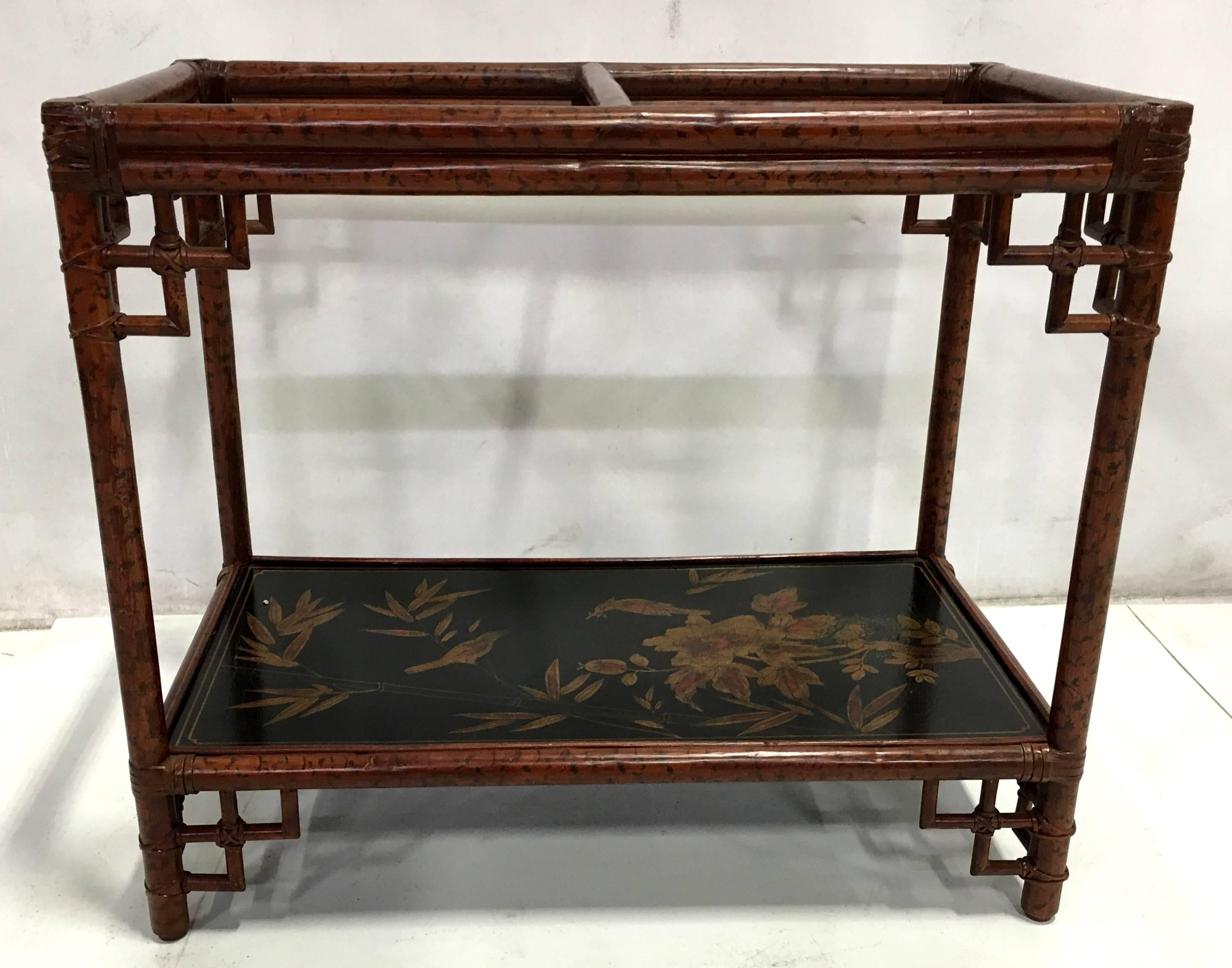 Lovely pair of rattan chinoiserie side tables by Maitland-Smith featuring their usual Fine finish painting. The lacquer panels on each table feature beautiful scenes of birds and foliage. New glass tops will be provided.