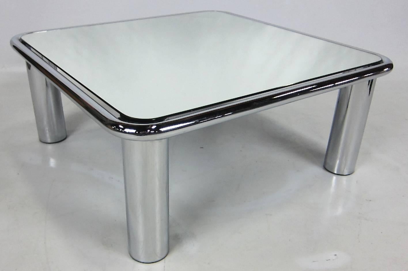 Stylish 1970s chrome coffee table with mirrored top by Gianfranco Frattini for Cassina. The table is in excellent original condition.