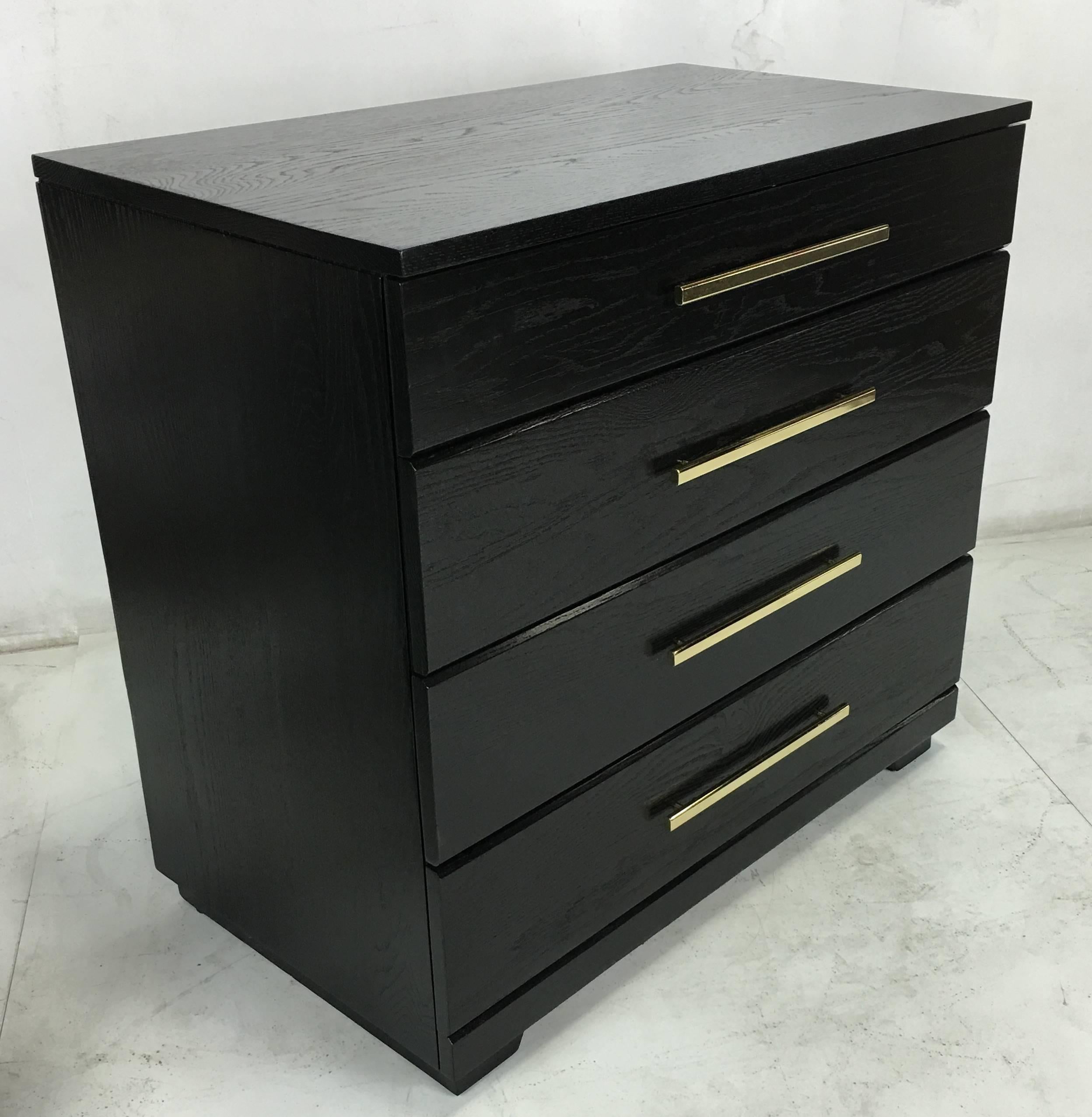 Beautifully crafted pair of Bedside Chests by Raymond Loewy for Mengel with polished brass bar pulls. The pair have been meticulously refinished in black lacquer.  All work done with painstaking quality at our in-house workroom.  