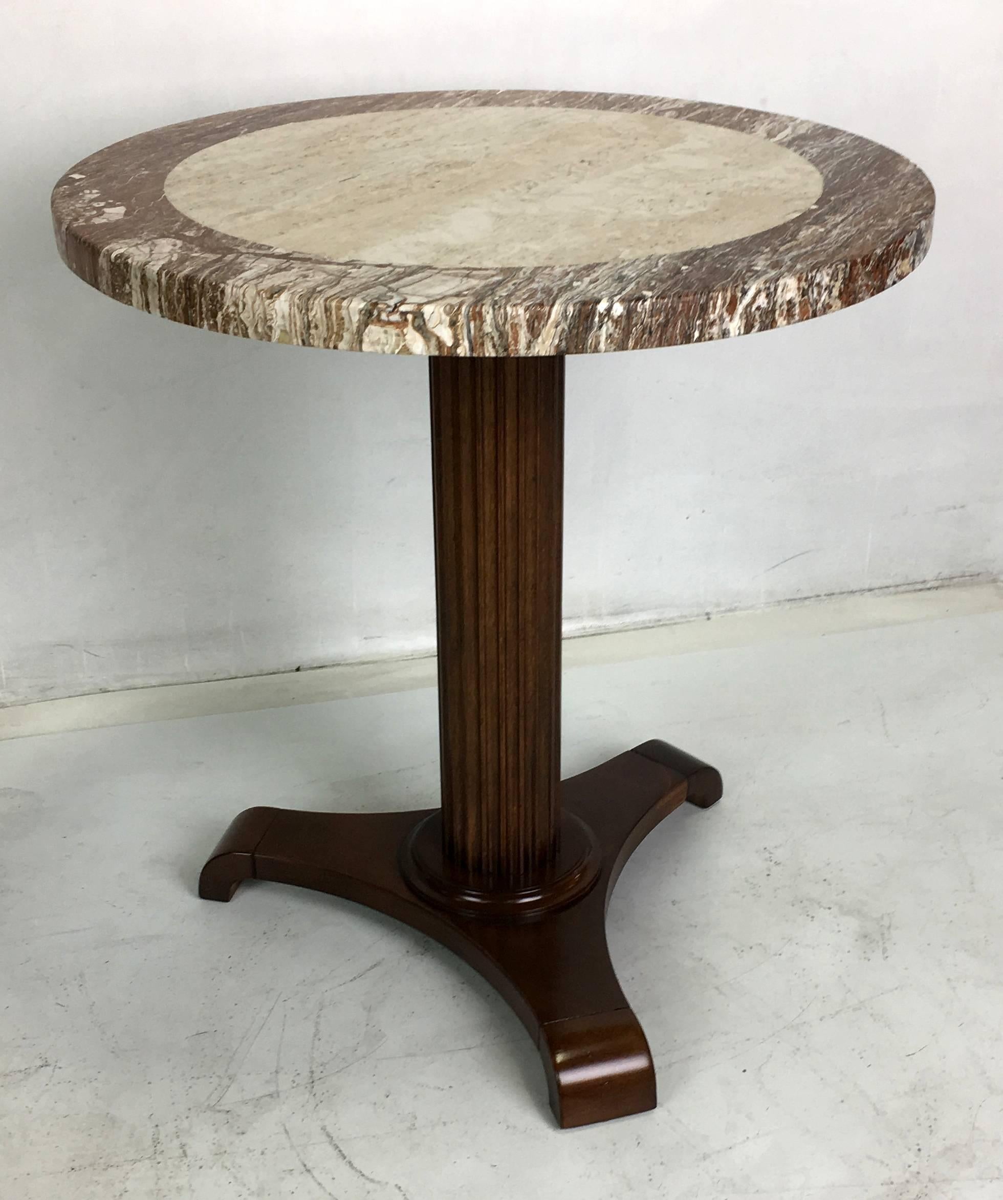 Lovely walnut gueridon with a fluted column neck on a tripartite base with scrolling feet supporting an Italian marble top.  All work done with painstaking quality at our in-house workroom.  