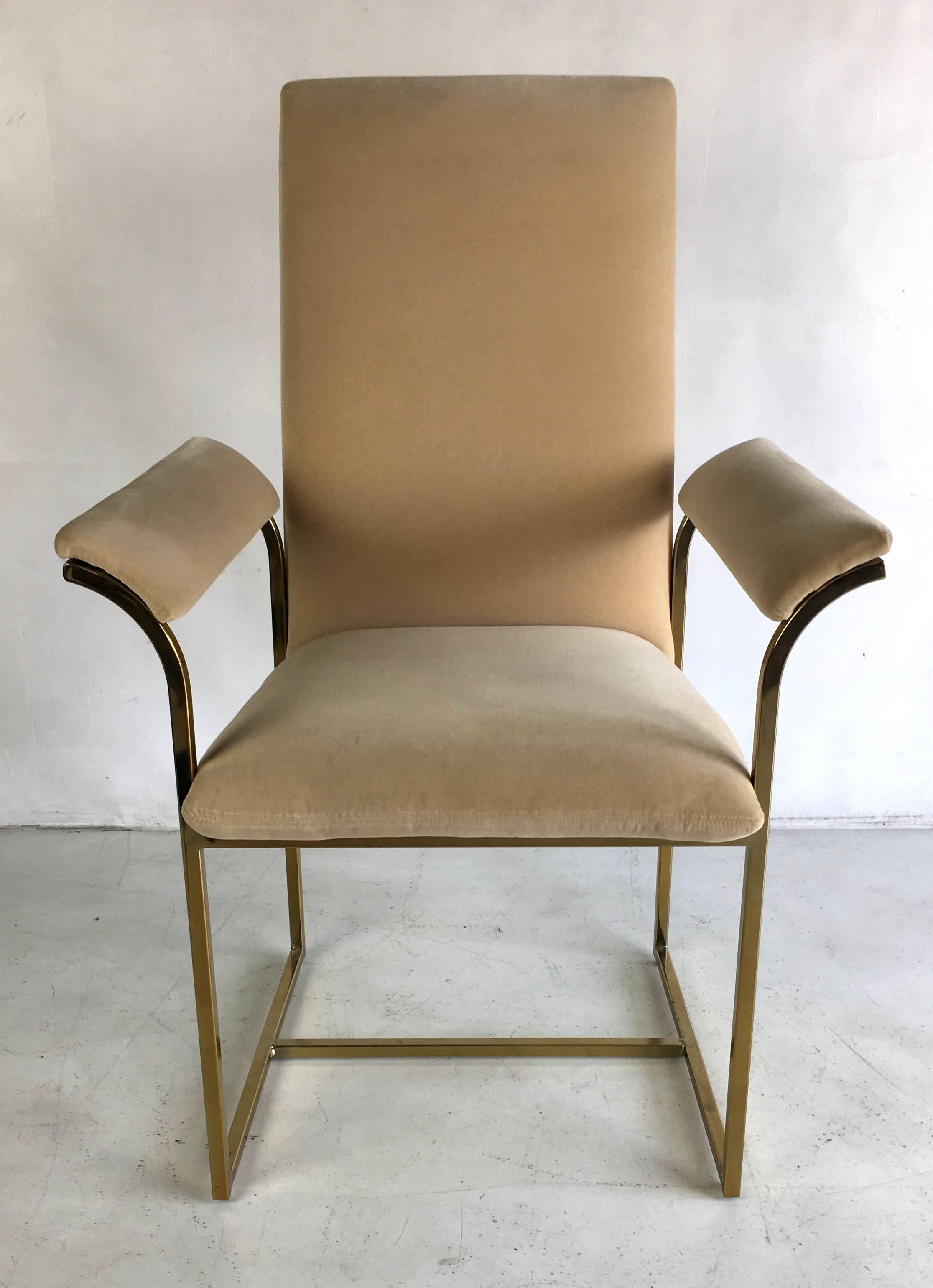 A wonderful set of six dining armchairs with brass frames in the style of Milo Baughman. The frames are in beautiful condition with a minimum of wear, one of the best sets we've had. They are a very comfortable and stylish example along with the