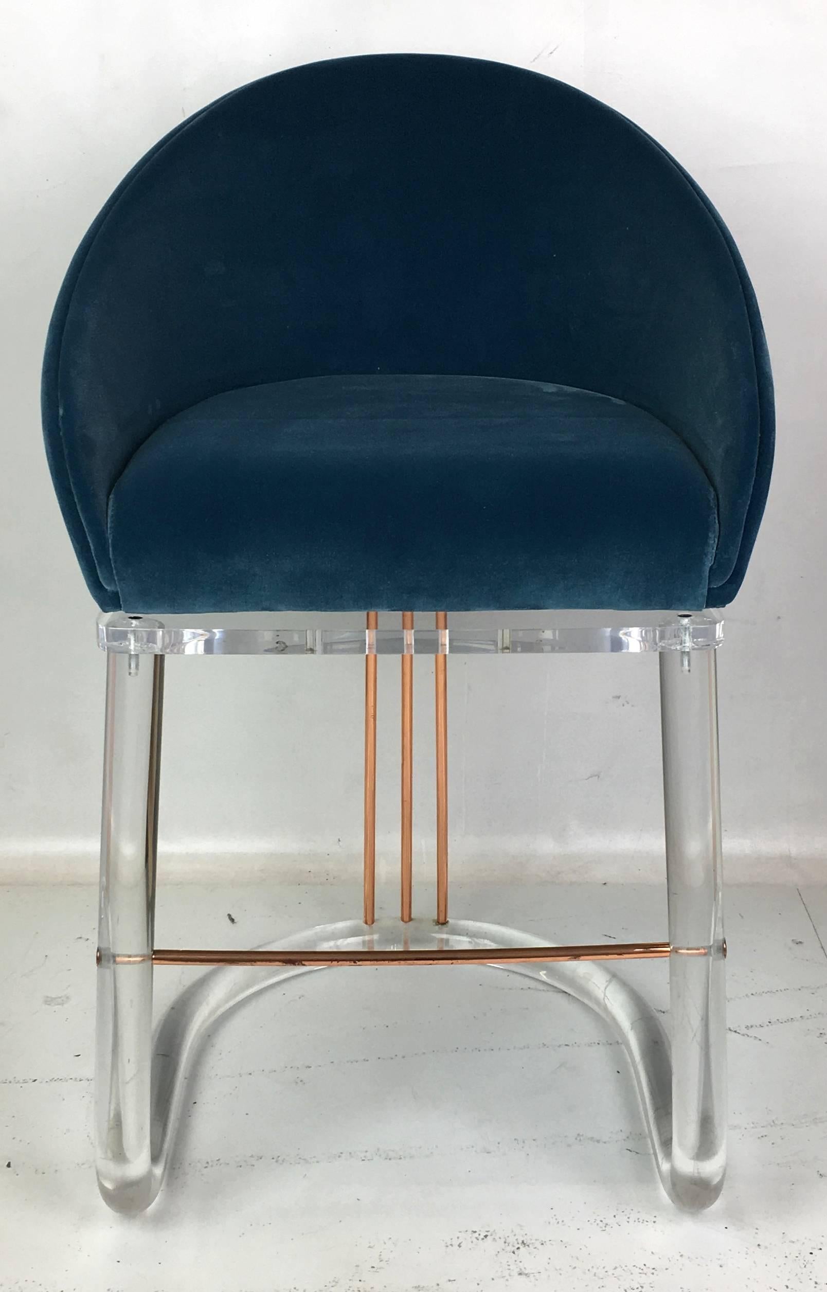 Beautiful pair of Lucite and brass barstools by Leon Frost. The barrel back seats swivel to a detente and return to center with a soft sprung mechanism.