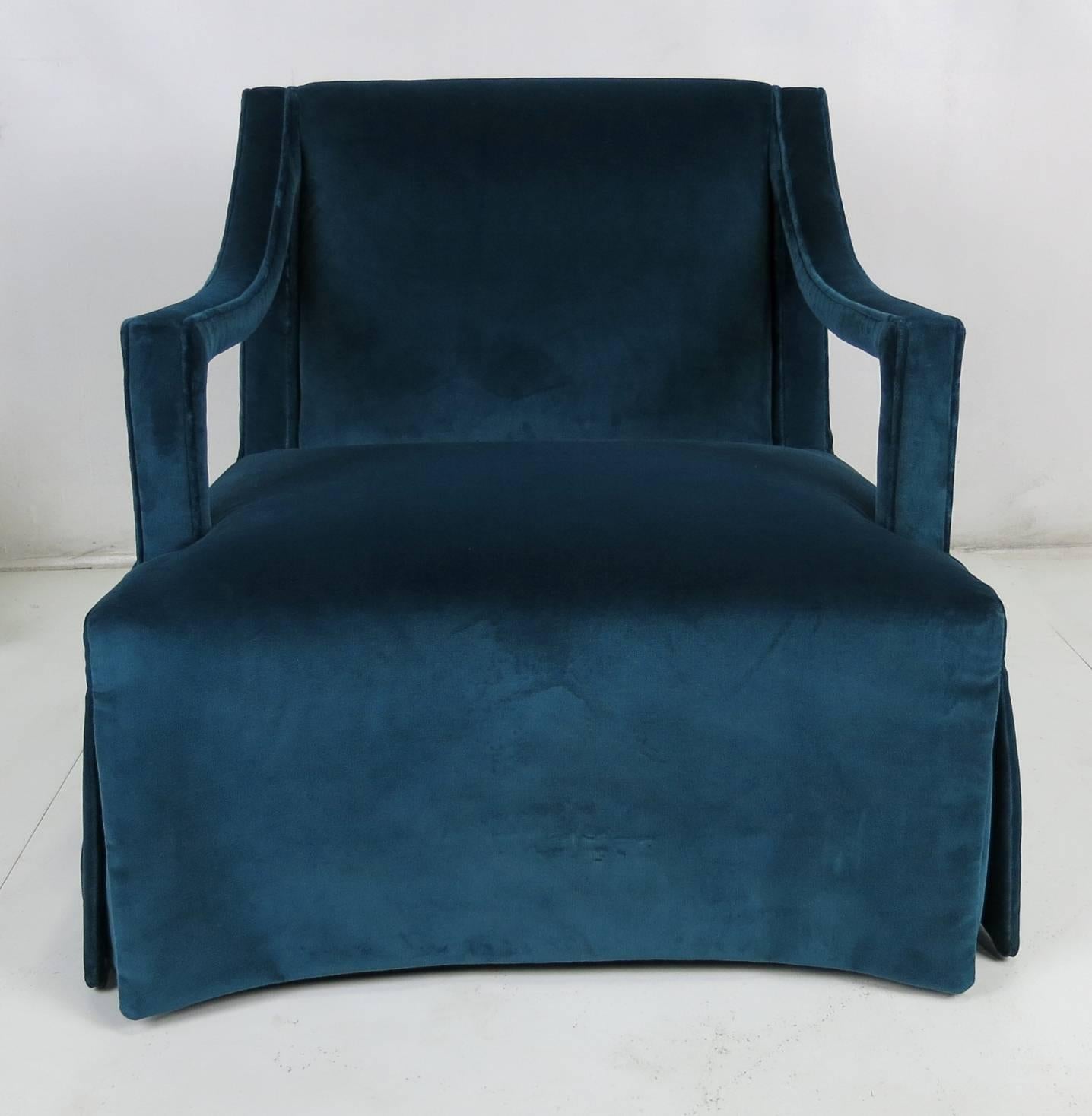 Beautiful pair of open-arm lounge chairs. The unusual and ultra chic upholstery has the skirts open to the seat. Fully restored from the ground up.
