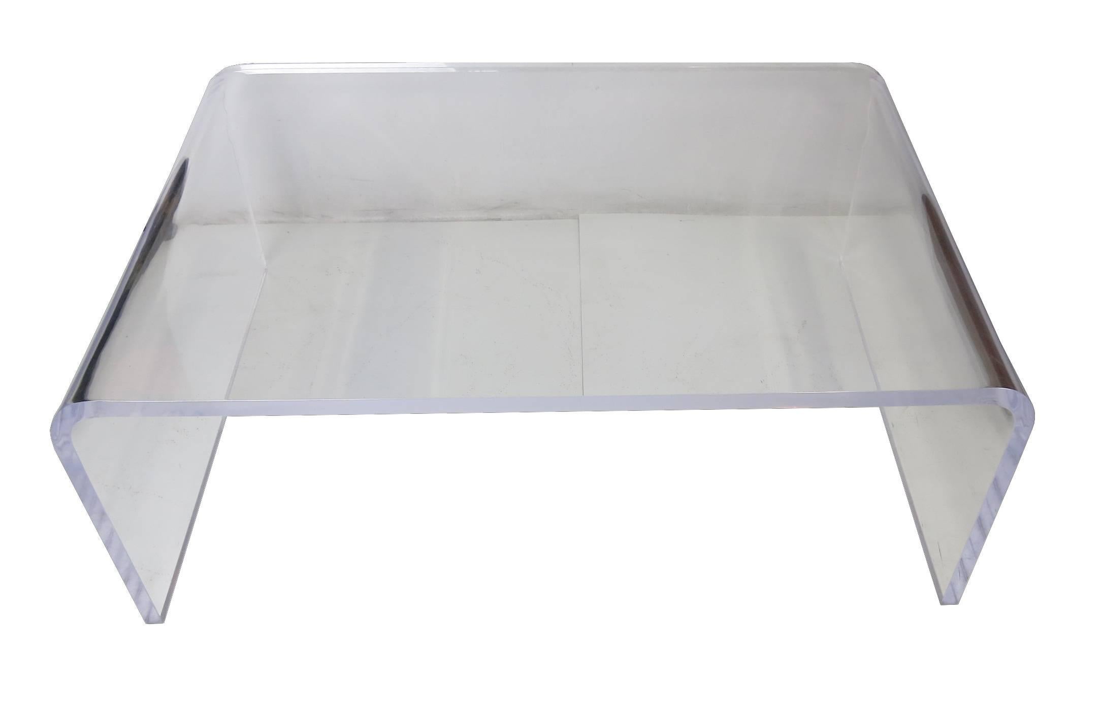 Classic Lucite Waterfall Cocktail Table.  Every Modern home needs one of these.    This item is in excellent condition and has been meticulously hand detailed.  